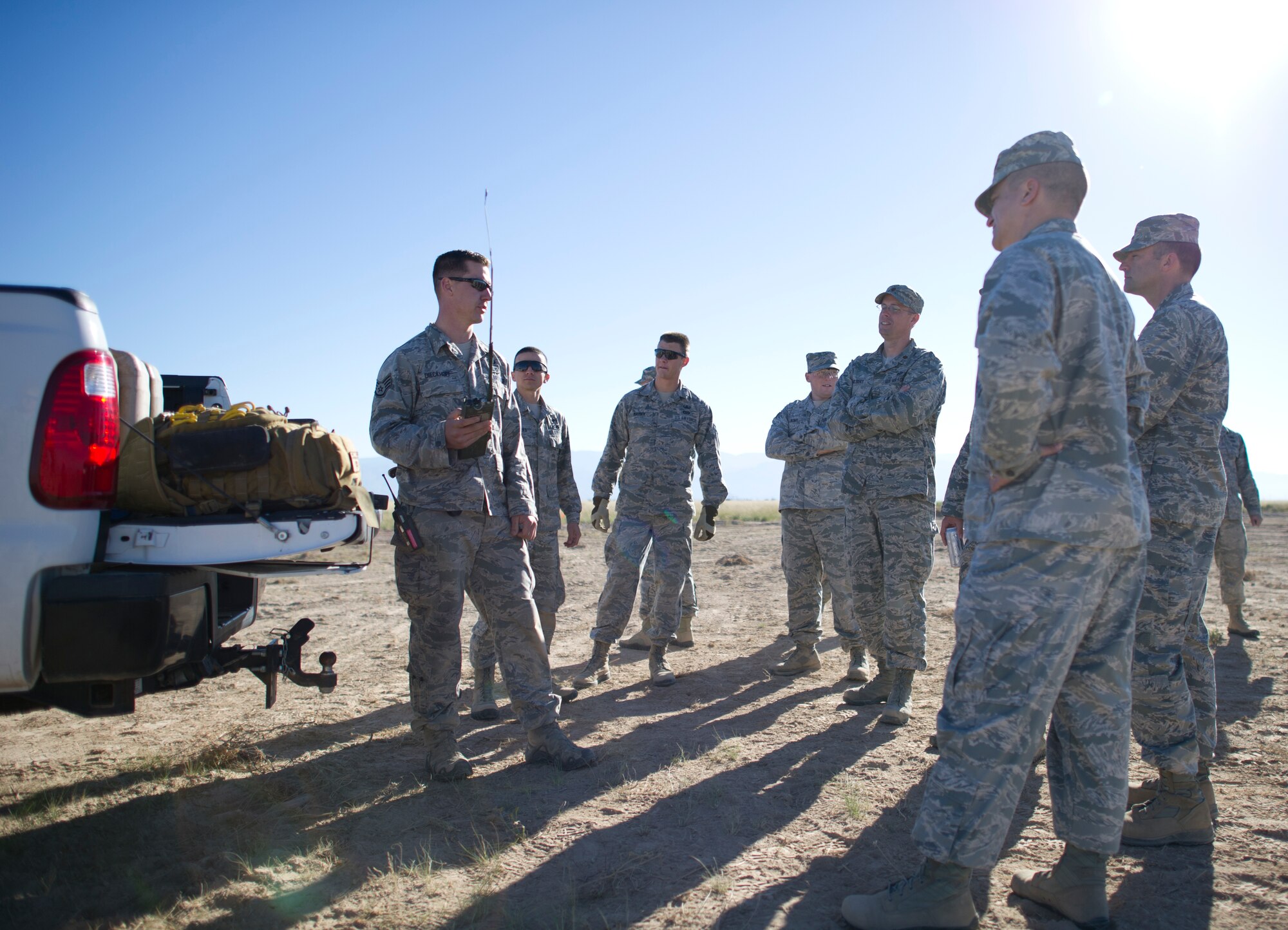 Staff Sgt. Evan Dieckhoff, 49th Civil Engineer Squadron Explosive Ordnance Disposal technician, briefs Col. Robert Brown, 49th Mission Support Group commander, and other technicians on the instructions and process used to safely initiate the days blast at Holloman Air Force Base, N.M., Oct. 28. Brown attended the inaugural blast of the EOD’s new demolition range, and he was shown by EOD technicians the process used to safely prepare and detonate explosives on a demolition range. (U.S. Air Force photo by Staff Sgt. Stacy Moless / Released)