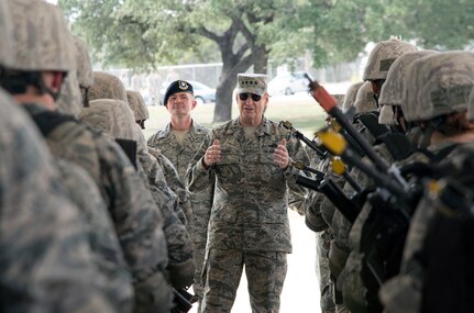 Gen. Robin Rand, commander of Air Education and Training Command, addresses security forces Airmen in training during his visit to the 343rd Training Squadron Oct. 29, 2014, at Joint Base San Antonio-Camp Bullis. Apprentice Airmen are taught elements of career-field orientation, weapons training, ground combat skills, basic air base defense tactics, law enforcement and additional survival tactics training to meet the needs of today's security forces Airmen. (U.S. Air Force photo by Johnny Saldivar)

