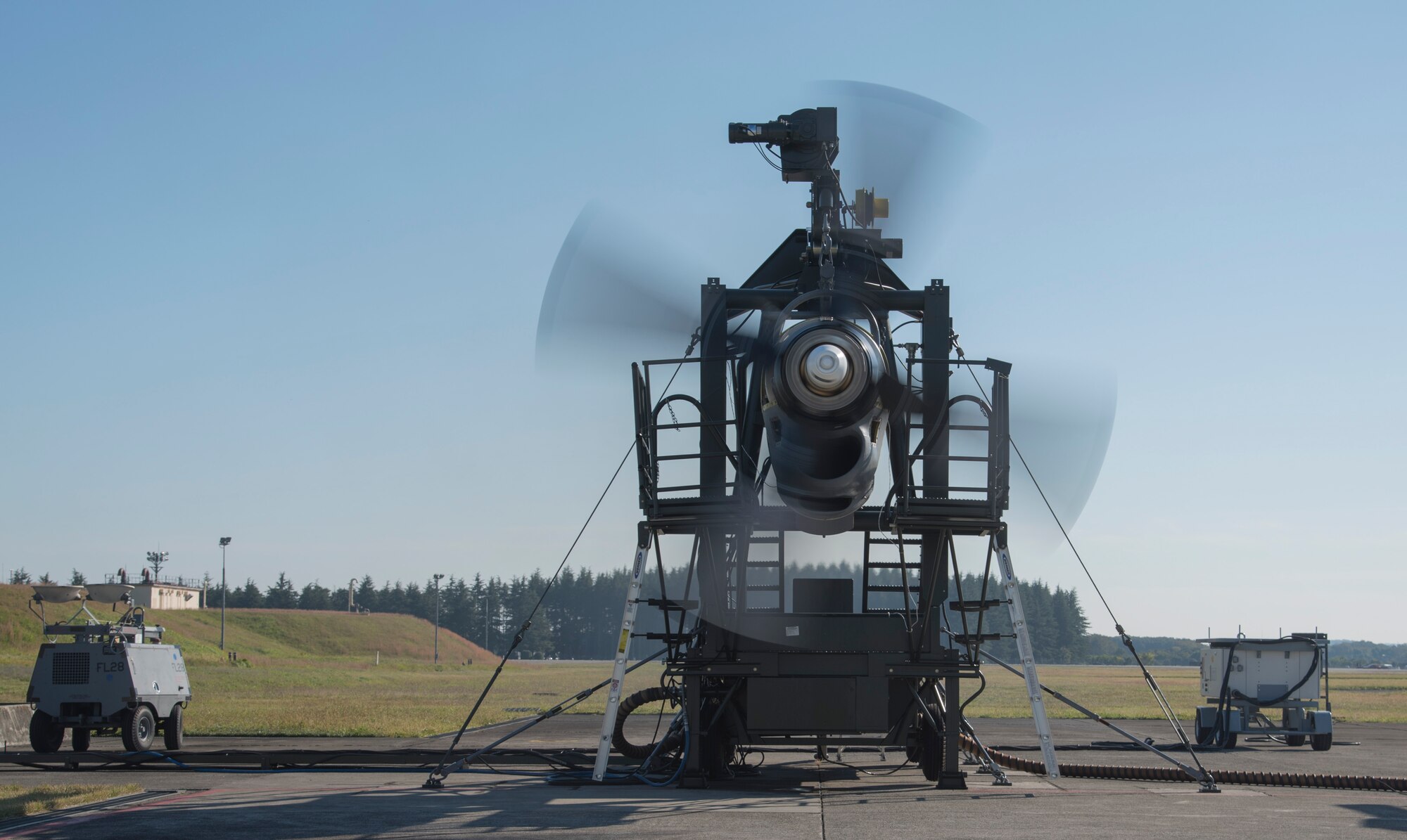 A C-130 T56 engine runs while being monitored for problems at the 374th Maintenance Squadron aerospace propulsion flight Test Cell facility at Yokota Air Base, Japan, Oct. 29, 2014. At the Test Cell facility and test cab, 374 MXS Airmen can diagnose any problem an engine may have and fix it in a short amount of time. (U.S. Air Force photo by Senior Airman Michael Washburn/Released)