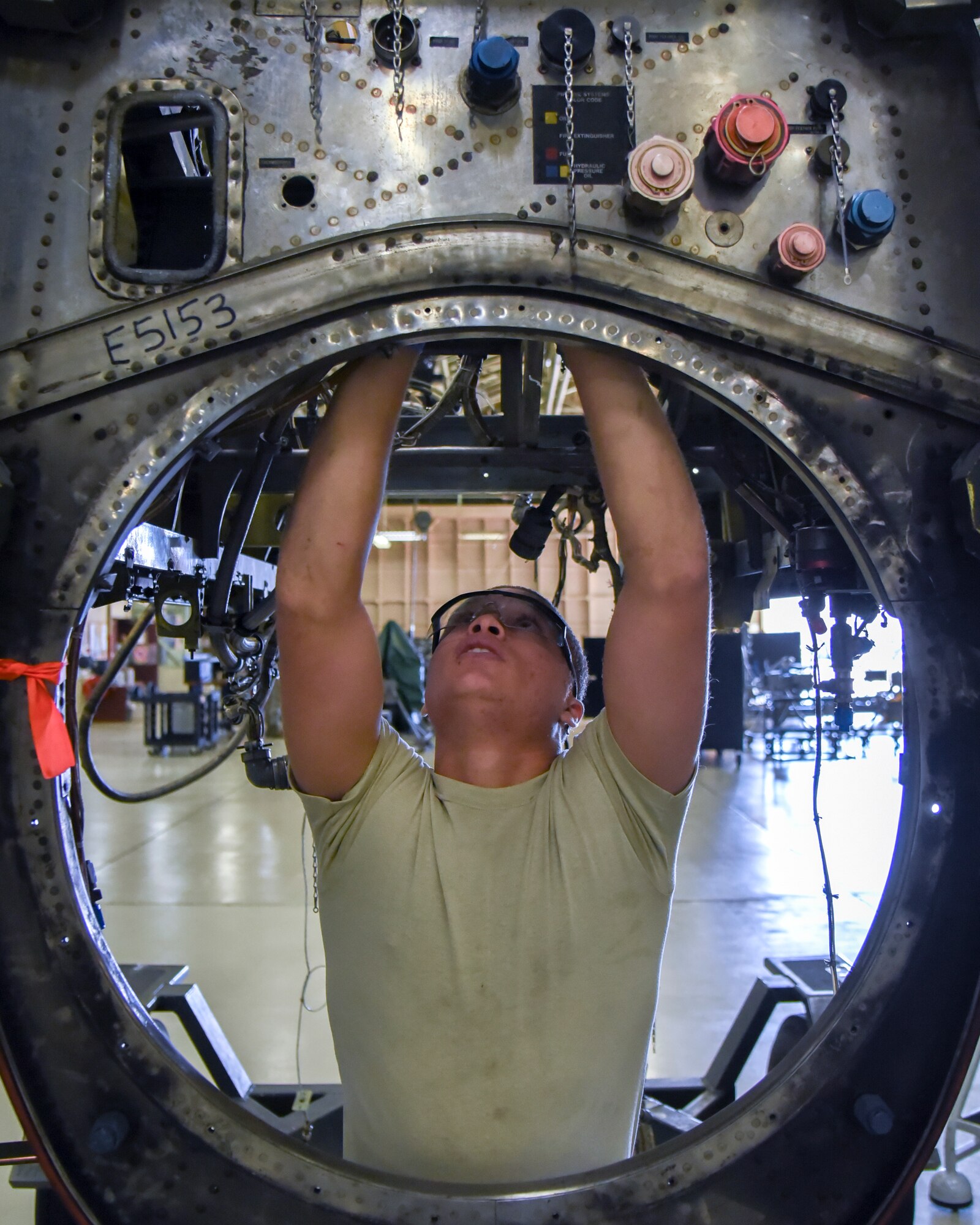 Airman 1st Class Nicolas Heldal, 374th Maintenance Squadron aerospace propulsion flight journeyman, works on a quick engine kit at Yokota Air Base, Japan, Oct. 29, 2014. After the parts are removed from the kit, it is cleaned, inspected, assembled with the serviceable parts and then sent off for painting. (U.S. Air Force photo by Senior Airman Michael Washburn/Released)