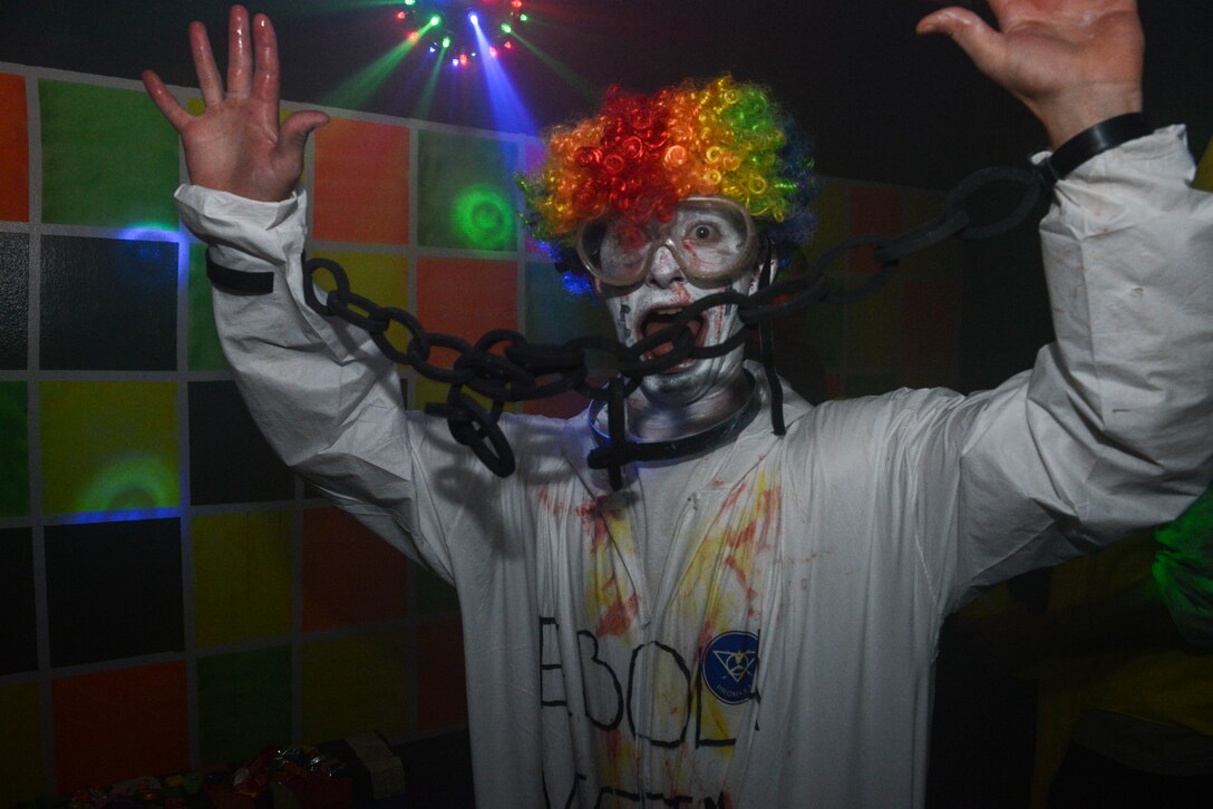 A member of Team Andersen attempts to scare people during 36th Civil Engineering Squadron haunted house, on Andersen Air Force Base Guam, Oct, 31, 2014. Several hundred Team Andersen family members visited the haunted house for Halloween. (U.S. Air Force photo by Senior Airman Adarius Petty /Released)