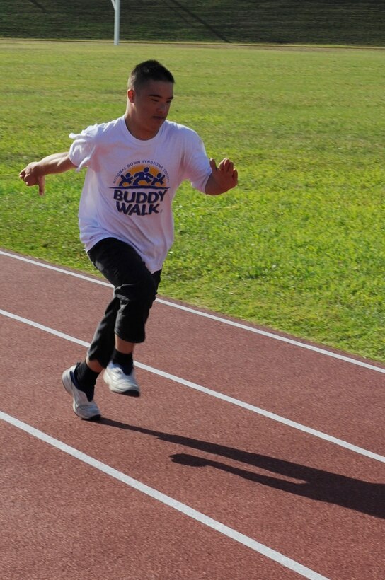 Ty Murdock, 11th grade Kadena High School student, practices for the Kadena Special Olympics on Kadena Air Base, Japan, Nov. 4, 2014. Murdock will be competing in the 30-meter dash. He enjoys the applause and cheering from the crowd when he races and the competition.  (U.S. Air Force photo by Staff Sgt. Marcus Morris) 