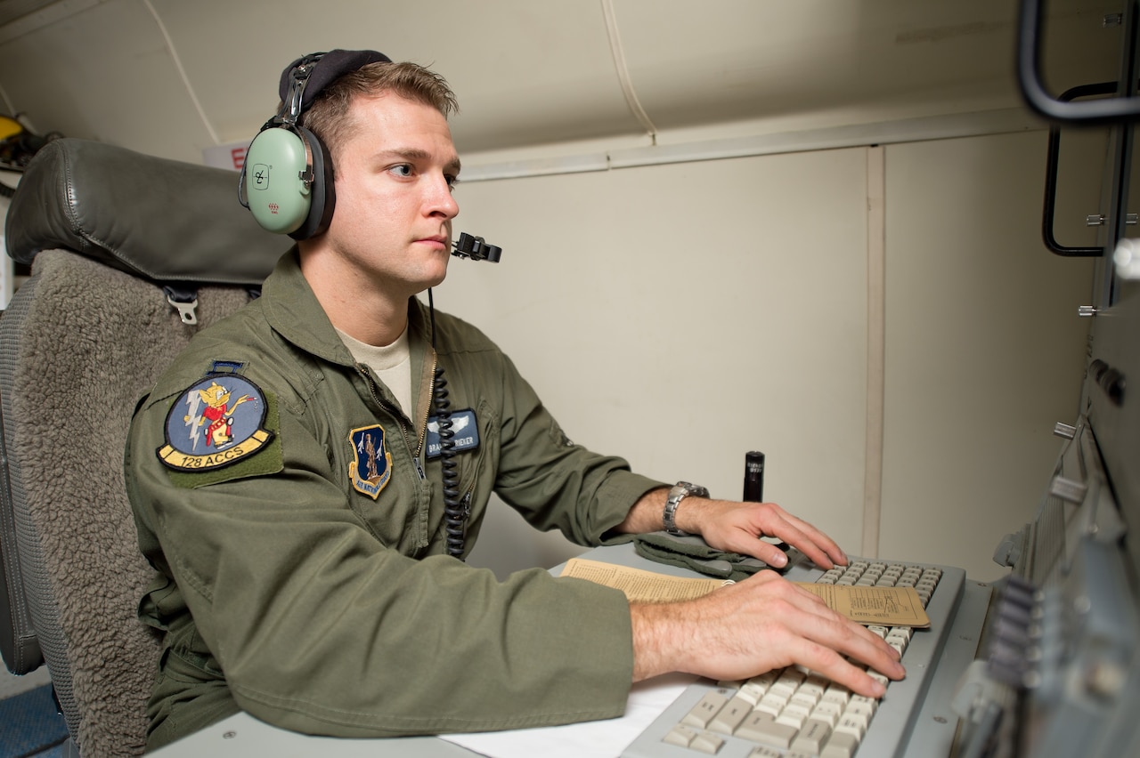Air Force Capt. Brandon Rieker, an air battle manager with the 116th Air Control Wing, Georgia Air National Guard, sits at an operator work station aboard an E-8C Joint Surveillance and Target Attack Radar System aircraft at Robins Air Force Base, Ga., Oct. 18, 2014. Rieker was selected to attend the U.S. Air Force Weapons School, Weapons Instructor Course at Nellis Air Force Base, Nev. U.S. Air Force photo by Senior Airman Kari Giles