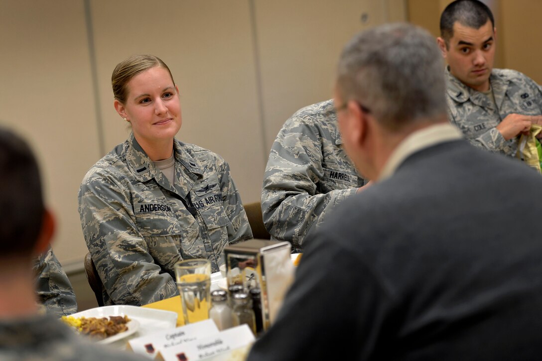 Air Force 1st Lt. Kimberly Anderson engages in a lunchtime conversation with Deputy Defense Secretary Bob Work during his visit to Creech Air Force Base near Las Vegas, Nov. 4, 2014. Anderson is assigned to the 432nd Aircraft Communications Maintenance Squadron.
