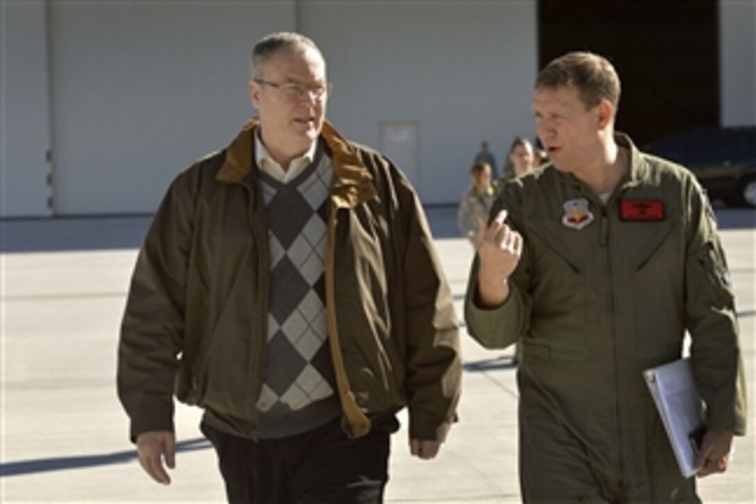 Deputy Defense Secretary Bob Work, left, is escorted by Air Force Col. Jim Chittenden, vice commander of the 432nd Air Expeditionary Wing, after visiting Creech Air Force Base near Las Vegas, Nov. 4, 2014.