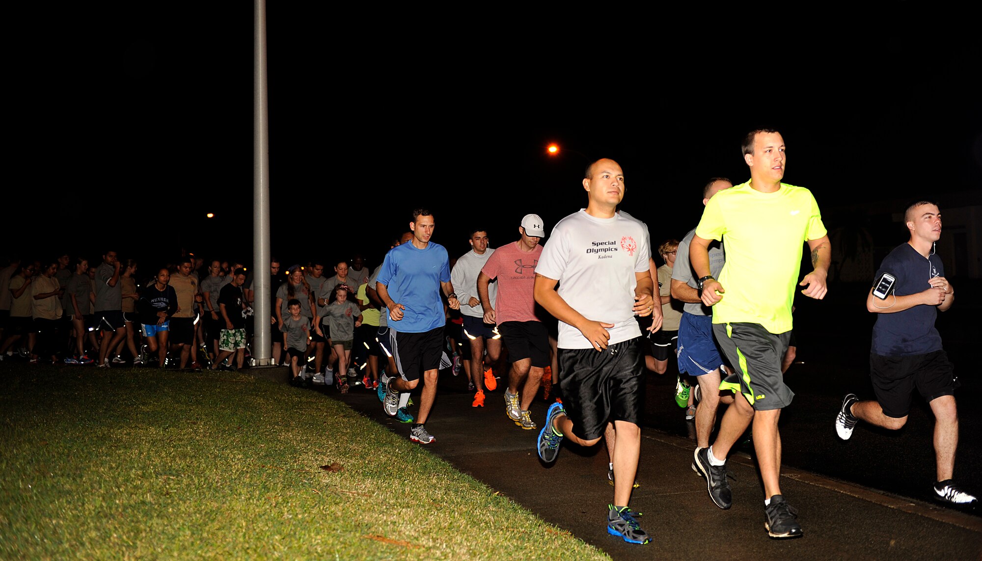 Members of the 353rd Special Operations Group and other participants run in support of the Kadena Special Olympics on Kadena Air Base, Japan, Oct. 31, 2014. The 353rd Special Operations Group hosted 128 runners and 52 volunteers at the Kadena Special Olympics 5k fun run to raise awareness for the KSO scheduled for Nov. 8. (U.S. Air Force photo by Naoto Anazawa)