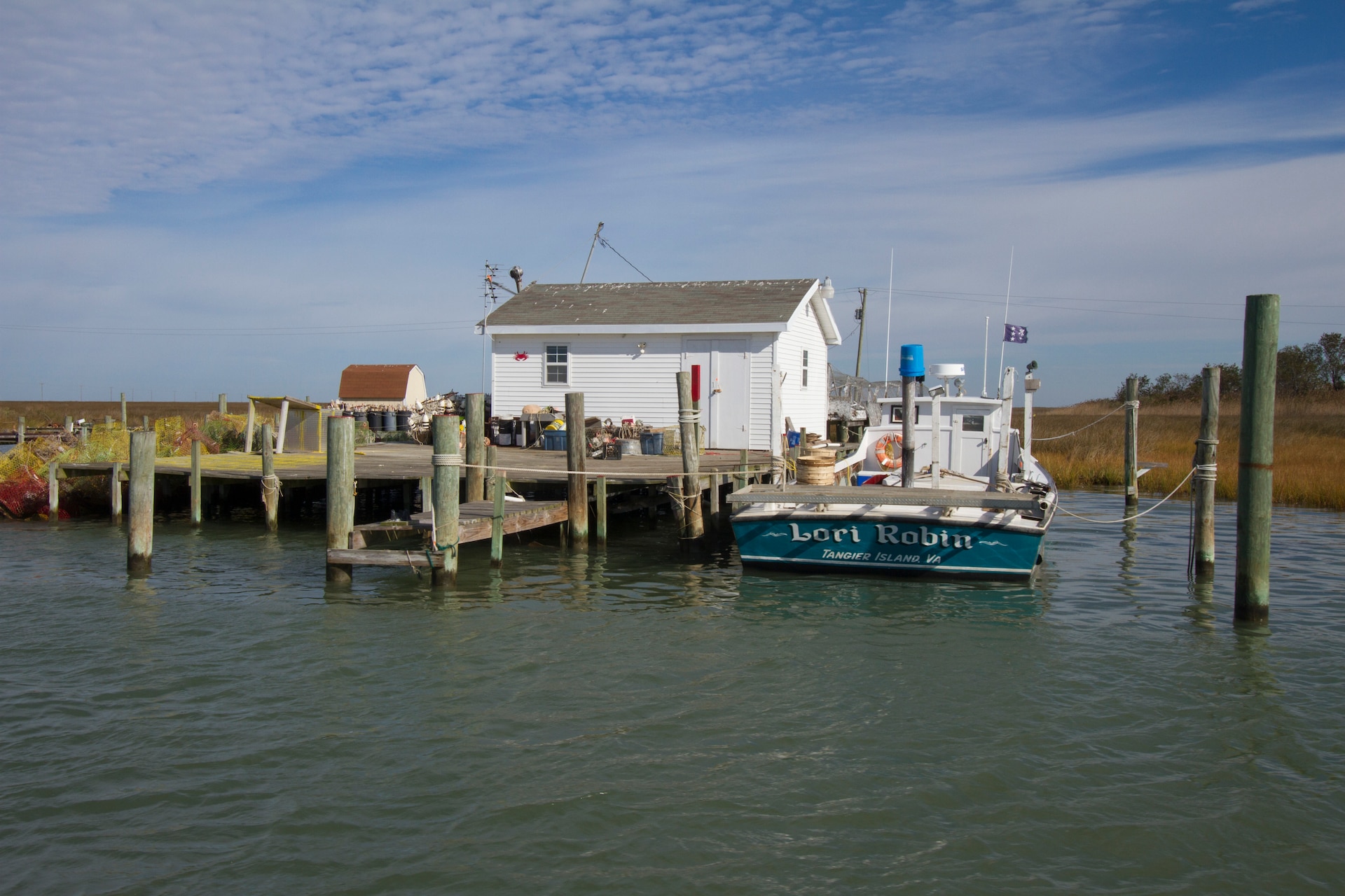 TANGIER, Va. – The Lori Robin, a Tangier Island based waterman boat sits dockside in the island’s harbor here November 3, 2014. The Norfolk District, U.S. Army Corps of Engineers is working on a breakwater that will help protect the boats and shacks in the harbor from damaging wave attack during coastal storms. (U.S. Army photo/Patrick Bloodgood)