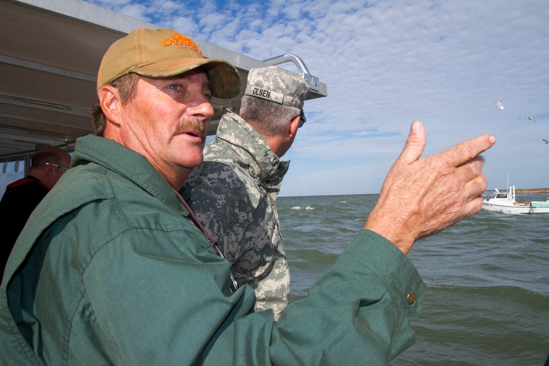 TANGIER, Va. – James “Ooker” Eskridge, mayor of Tangier, points out some areas of concern to Col. Paul Olsen, Norfolk District commander, during a boat tour of Tangier Island. The district is working on a jetty project for the island as well as dredging the island’s navigation channel. 