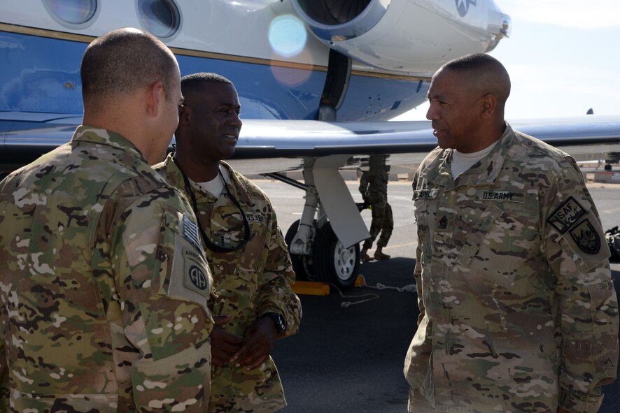 Retired Command Sgt. Maj. Thomas Capel, left, returns from taking Wounded Warriors to Afghanistan as part of Operation Proper Exit on Nov. 2, 2014. Operation Proper Exit, part of the Troops First Foundation, provides the opportunity for wounded warriors to return to the battle space, share their experiences – both good and bad – and most importantly, leave the theater on their own terms. (U.S. Air Force photo byTech. Sgt. Jared Marquis)