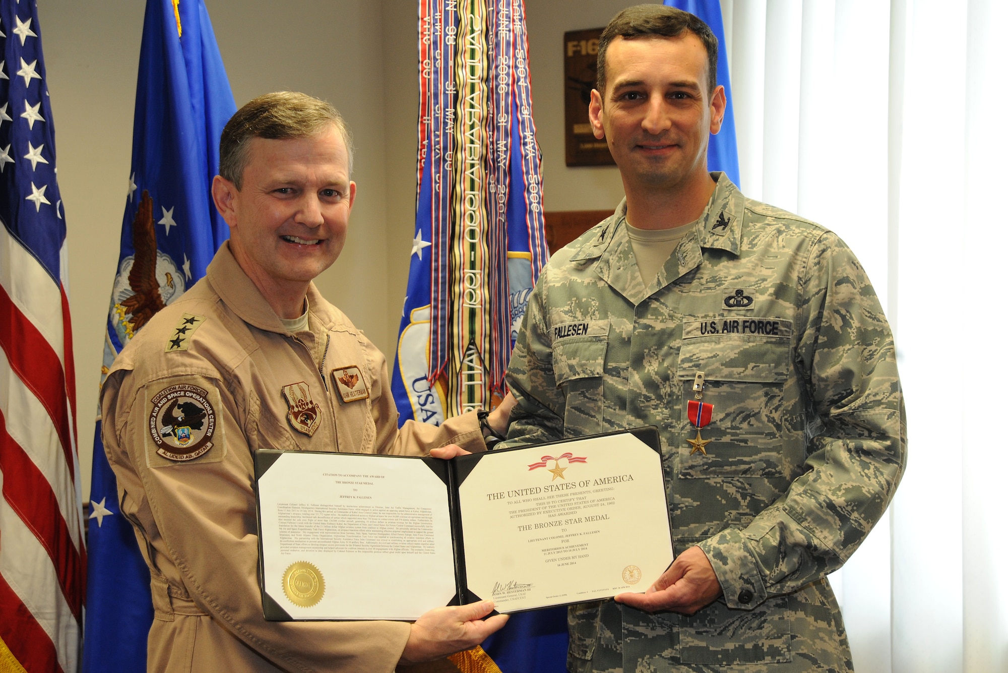 Lt. Gen. John Hesterman, Air Forces Central Command commander, presents a Bronze Star medal to Col. Jeffrey Fallesen, AFCENT chief of staff, at Shaw Air Force Base, S.C., Oct. 28, 2014. Fallesen received the medal for serving as director of joint air traffic management for ISAF headquarters in Kabul, Afghanistan, from July 2013 to July 2014. (U.S. Air Force photo by Airman 1st Class Michael Cossaboom/Released)   