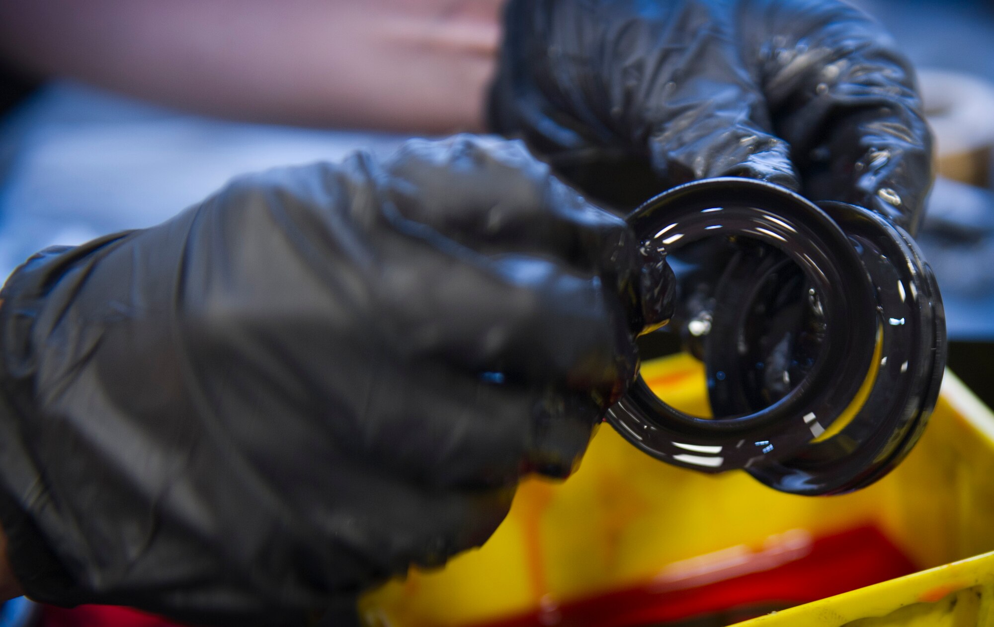 Senior Airman Rachael Jenkins, 1st Special Operations Equipment Maintenance Squadron armament journeyman, lubricates seals at the armament shop on Hurlburt Field, Fla., Nov. 4, 2014. Armament equipment is cleaned and inspected weekly. (U.S. Air Force photo/Senior Airman Krystal M. Garrett) 