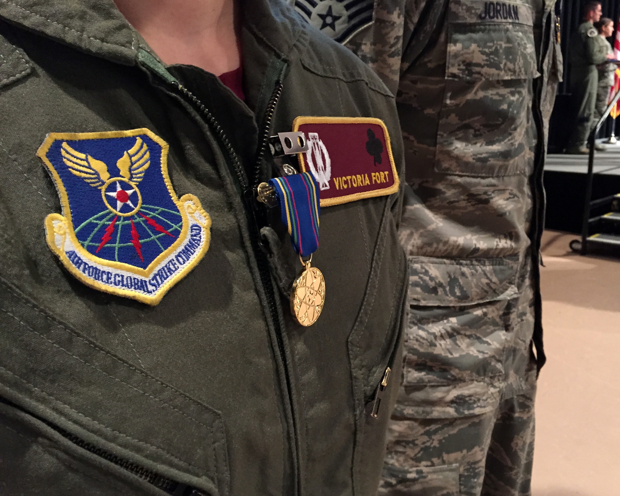 First Lt. Victoria Fort dons the very first Nuclear Deterrence Operations Service Medal  Nov. 5, 2014, during Air Force Global Strike Command’s 2014 Global Strike Challenge at the Bossier Civic Center, Bossier City, La.  Fort is a missile combat crew instructor from the 91st Missile Wing at Minot Air Force Base, N.D. (U.S. Air Force photo/1st Lt. Christopher Mesnard)