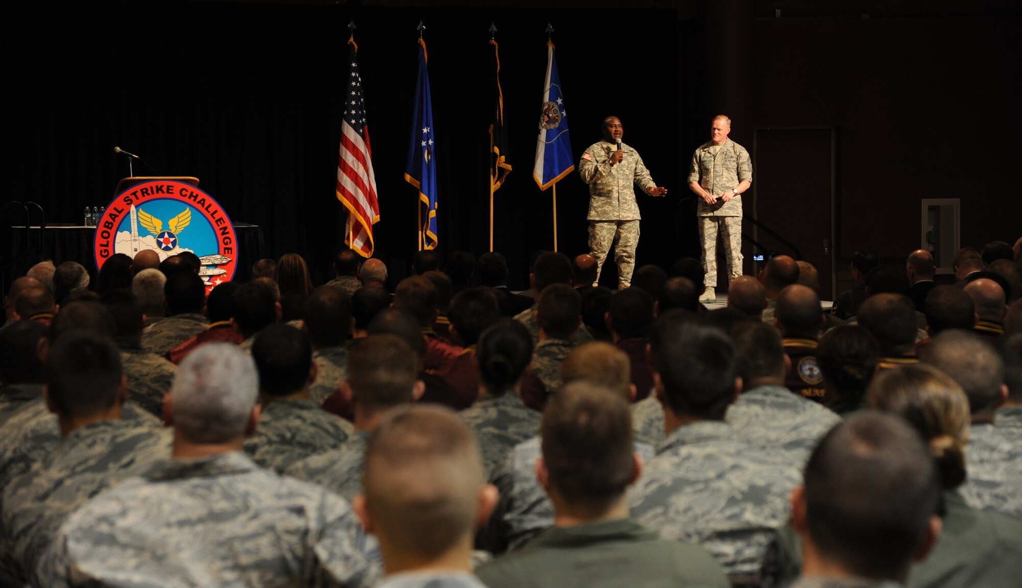 Chief Master Sgt. of the Air Force James A. Cody (right) and Command Sgt. Maj. Patrick Alston speak to a crowd of nearly 800 Airmen and attendees Nov. 5, 2014, at the Global Strike Challenge 2014 Technology and Innovation Symposium in the Bossier Civic Center, Bossier City, La. Cody and Alston talked about core values and profound leadership. Alston is the senior enlisted leader at U.S. Strategic Command. (U.S. Air Force photo/Senior Airman Janelle Dickey) 
