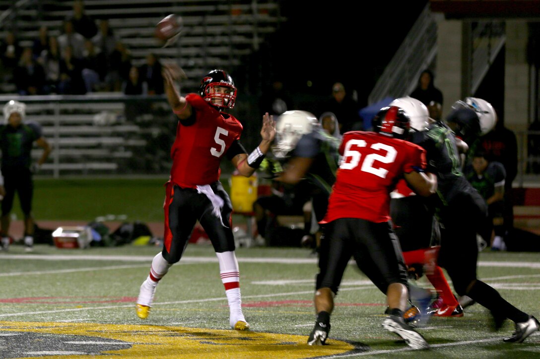 Greg Sargeant, Marine Corps Air Station Miramar Falcons’ quarterback attempts a pass during a game against the Headquarters Support Battalion Spartans aboard Marine Corps Base Camp Pendleton, Calif., Nov. 4. The Falcons lost to the Spartans in overtime 7-0.