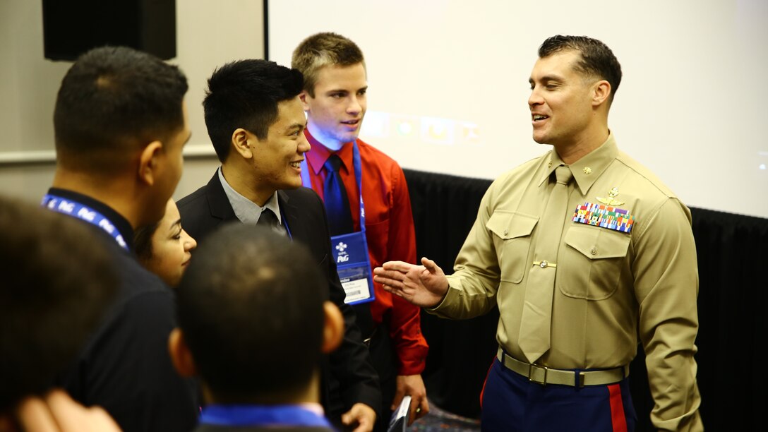 Detroit, Michigan (November 06, 2014) --  Major Byron Owen, Commanding Officer, First Reconnaissance Company, I MEF, speaks to students about the importance of leadership at the 2014 Society of Hispanic Professional Engineers (SHPE) Symposium, here, today. The Marine Corps recognizes this event as a valuable opportunity to foster positive relationships with members, share the Marine story, demonstrate enthusiasm for the Corps and reinforce the idea of the armed services as a viable career option within the Hispanic American community.