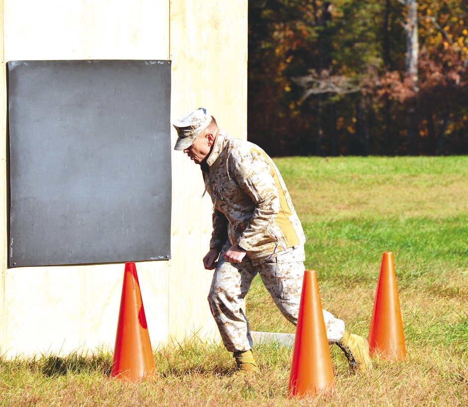 Brig. Gen. Joseph Shrader, commander, Marine Corps Systems Command, experiences the effects of the Active Denial System at Marine Base Quantico on Oct. 30. The ADS was demonstrated for multiple services and government agencies. The non-lethal weapons system creates an intolerable heating sensation that engages the body’s instinctive flight response.
