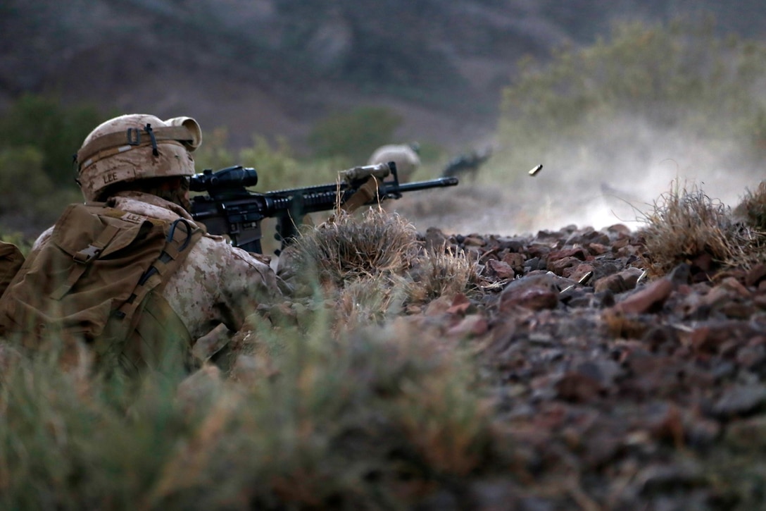 U.S. Marines with Weapons Company, Battalion Landing Team 2nd Battalion, 1st Marines, 11th Marine Expeditionary Unit (MEU), take cover near their objective during a live-fire and movement exercise as part of sustainment training at D’Arta Plage, Djibouti, Nov. 3. Marines from the 11th MEU are deployed as a flexible, adaptable and persistent force in the U.S. 5th Fleet area of responsibility. (U.S. Marine Corps photos by Gunnery Sgt. Rome M. Lazarus/Released) 