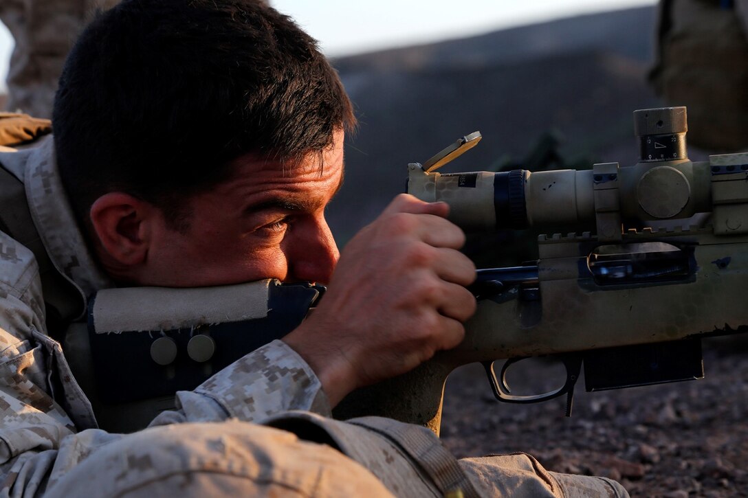 U.S. Marine Corps Cpl. Matthew D. Harris, a scout sniper team leader with Weapons Company, Battalion Landing Team 2nd Battalion, 1st Marines, 11th Marine Expeditionary Unit (MEU), and native of Butler, Indiana, provides precision fire during a live-fire and maneuver exercise as part of sustainment training at D’Arta Plage, Djibouti, Nov. 3. The 11th MEU is deployed to maintain regional security in the U.S. 5th Fleet area of responsibility. (U.S. Marine Corps photos by Gunnery Sgt. Rome M. Lazarus/Released) 