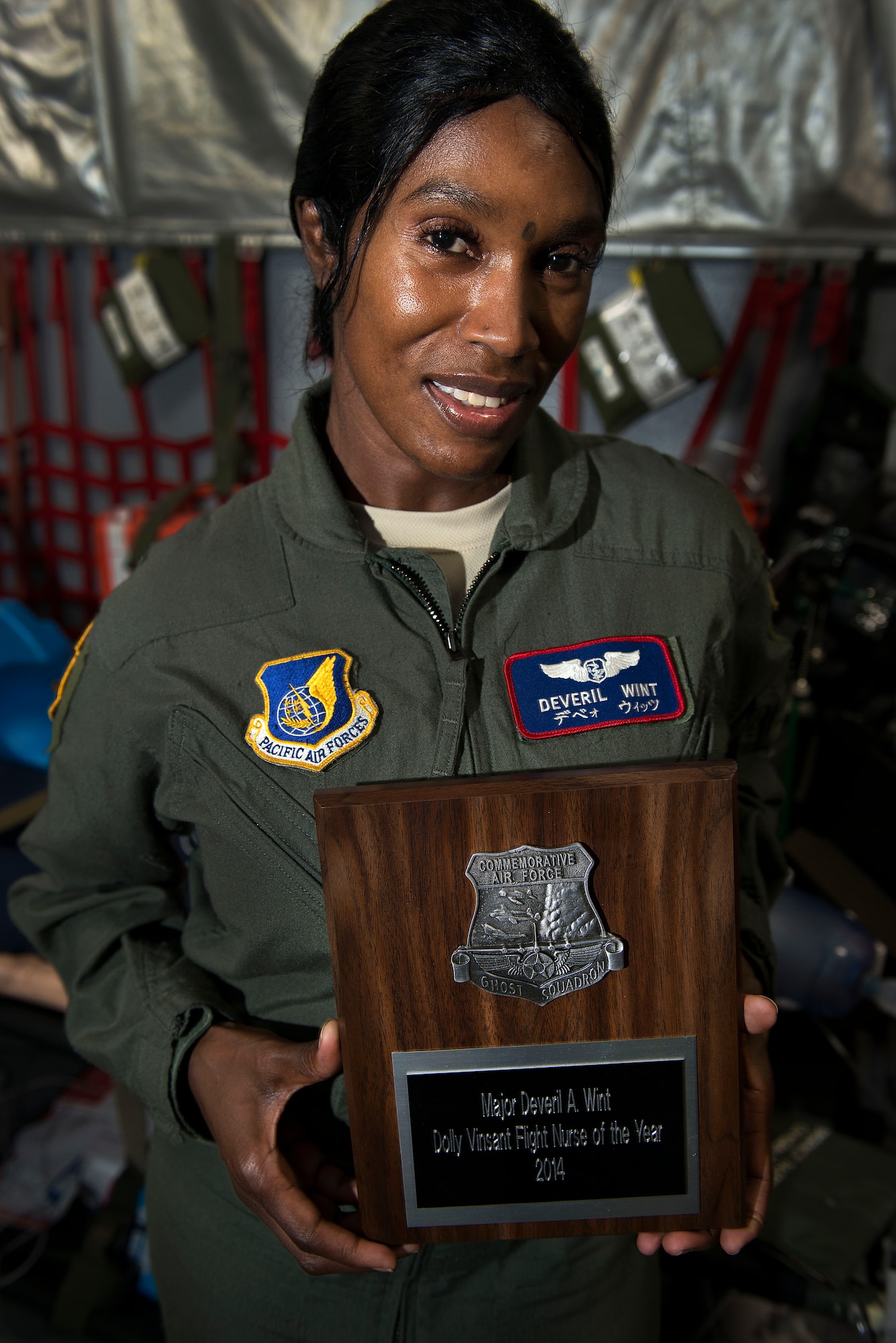 U.S. Air Force Maj. Deveril Wint, 18th Aeromedical Evacuation Squadron operations flight commander, recently claimed the Commemorative Air Force Dolly Vinsant Flight Nurse of the Year Award for her actions throughout 2013. Wint is a Montego Bay, Jamaica, native, who has been in the Air Force for roughly 17 years as a neonatal and aeromedical evacuation nurse. (U.S. Air Force photo by Senior Airman Maeson L. Elleman/Released)
