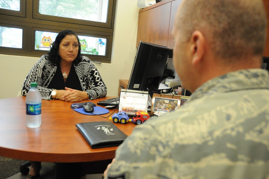 U.S. Air Force Chief Master Sgt. James W. Hotaling, command chief master sgt. of the Air National Guard, addresses the concerns of Lorna Souza, Airman and Family Readiness Program Manager of the Hawaii Air National Guard, during his visit to the 154th Wing at Joint Base Pearl Harbor Hickam on Nov. 5, 2014. Souza describes the challenges of force reduction and how it directly affects airman in the Hawaii Air National Guard. (U.S. Air Force photo by Airman 1st Class Robert Cabuco)