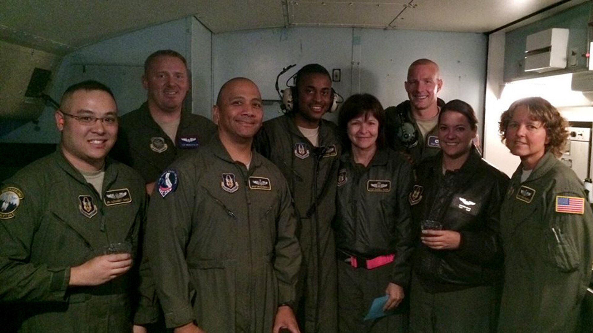 Senior Master Sgt. Dianne Valdez, a loadmaster evaluator with the 312th Airlift Squadron, surpassed the milestone of 10,000 flying hours Oct. 16, 2014. Posing for the celebratory picture, from left: Senior Airman Alex Shimizu, 312th AS, Staff Sgt. Mehalic Blair 22nd AS; Senior Master Sgt. Bruce Ronquillio 312th AS; Tech Sgt. Josh Jackson, 312th AS; Senior Master Sgt. Dianne Valdez, 312th AS; Staff Sgt. Phillip Bean, 60th Aircraft Maintenance Squadron; Tech. Sgt. Kristen Lewis, 312th AS; Senior Master Sgt. Terri Russick, 312th AS. (Courtesy photo)