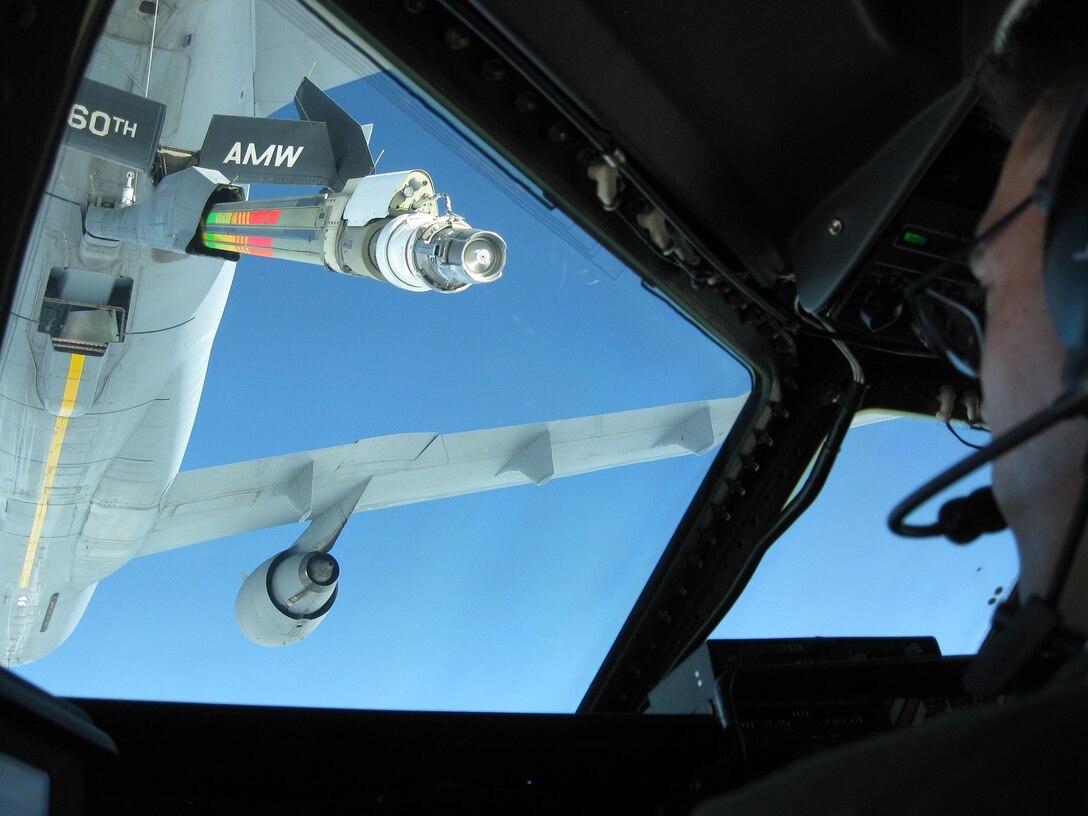 TRAVIS AIR FORCE BASE, Calif. -- An Air Force Resere aircrew prepares to receive fuel from a KC-10 Extender during the 349th Air Mobility Wing's Focus on the Family event Oct. 25, 2014, at Travis Air Force Base, Calif. The event included an orientation flight for spouses on either the KC-10, C-5, or C-17 aircraft, briefings and informative sessions on the benefits of being an Air Force Reserve spouse and a barbecue lunch to bring together all as part of the "349th Family". Another Focus on the Family event is scheduled to be held during the November 2014 A Flight Unit Training Assembly weekend. (Courtesy photo)