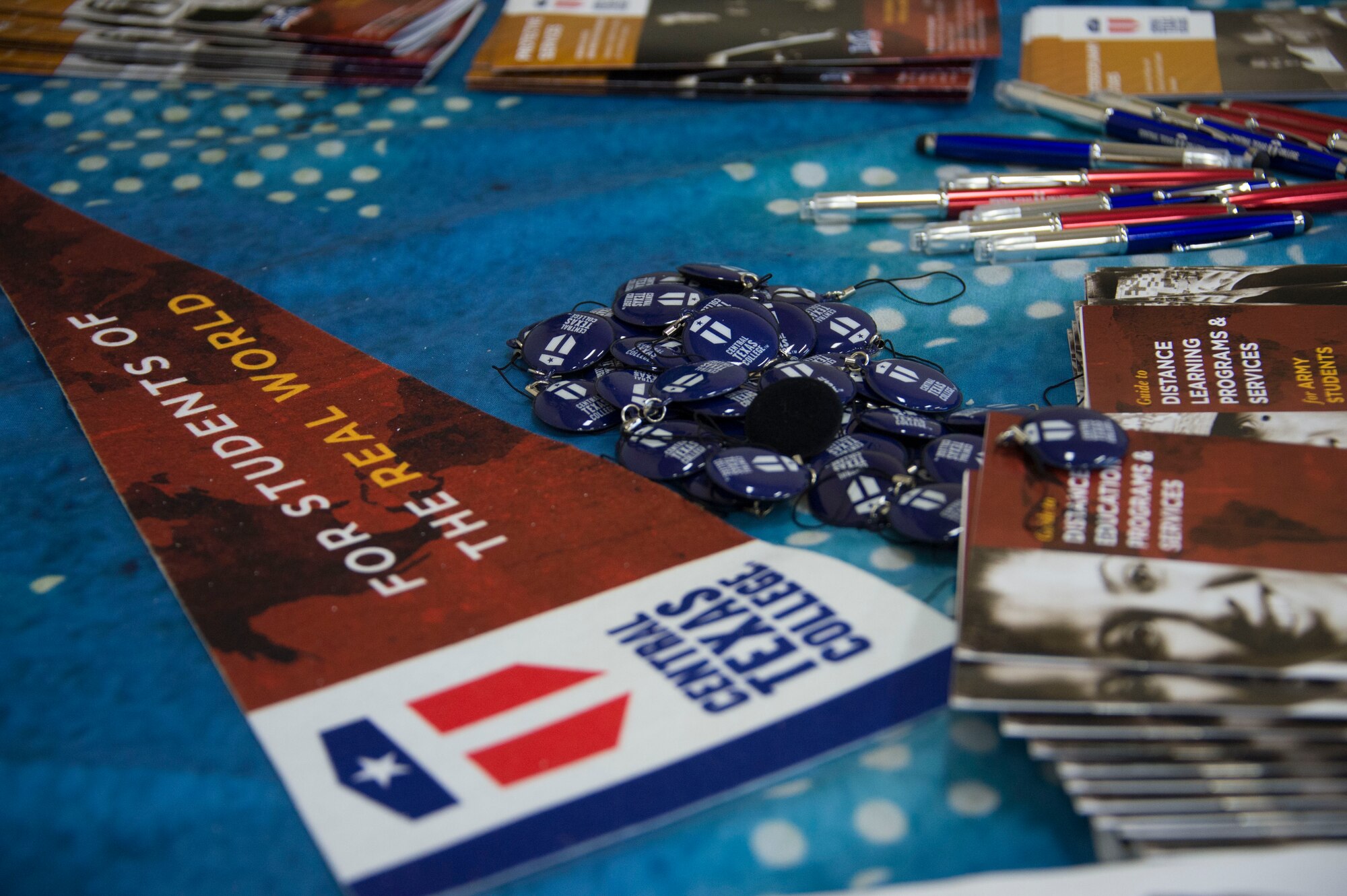 Information packets from several DoD approved schools line the tables at the Recreation Center during the Education Fair at Soto Cano Air Base, Honduras, Nov. 5, 2014.  The Education Fair was provided by the Army Support Activity to give members information on degree plans, degree completion, as well as classroom and distance learning options. (U.S. Air Force photo/Tech. Sgt. Heather Redman)