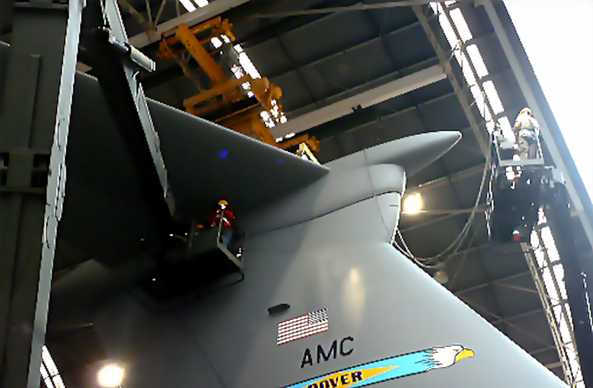 Flight control mechanics install the tail on a C-5M. The Warner Robins Air Logistics Complex will be completing a new retrofit on 51 C-5s between now and 2020.
U.S. Air Force photo by Isaac Cruz
