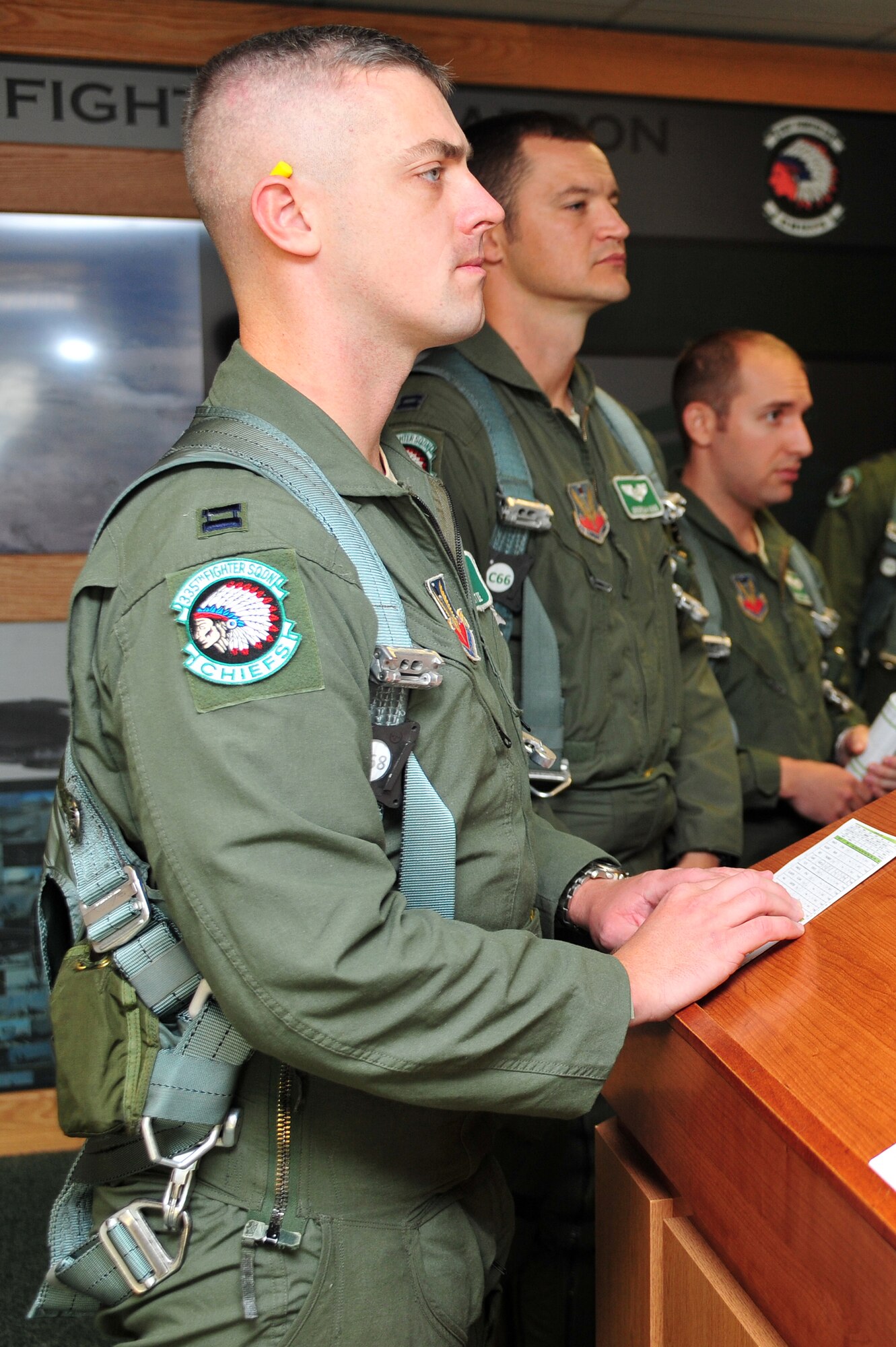 Capt. Matthew Olde, 335th Fighter Squadron pilot, attends a pre-flight briefing at Seymour Johnson Air Force Base, North Carolina, Oct. 11, 2014, before heading to Nellis Air Force Base, Nevada, in support of the U.S. Air Force Weapons School’s Weapons Instructor Course. Airmen and aircraft assigned to the 4th Fighter Wing out of Seymour Johnson AFB recently returned home from Nellis AFB, where they were tasked with enhancing the F-15E Strike Eagle capability and provide additional air support for the students attending the Weapons School’s Weapons Instructor Course. (U.S. Air Force photo/Senior Airman John Nieves Camacho)