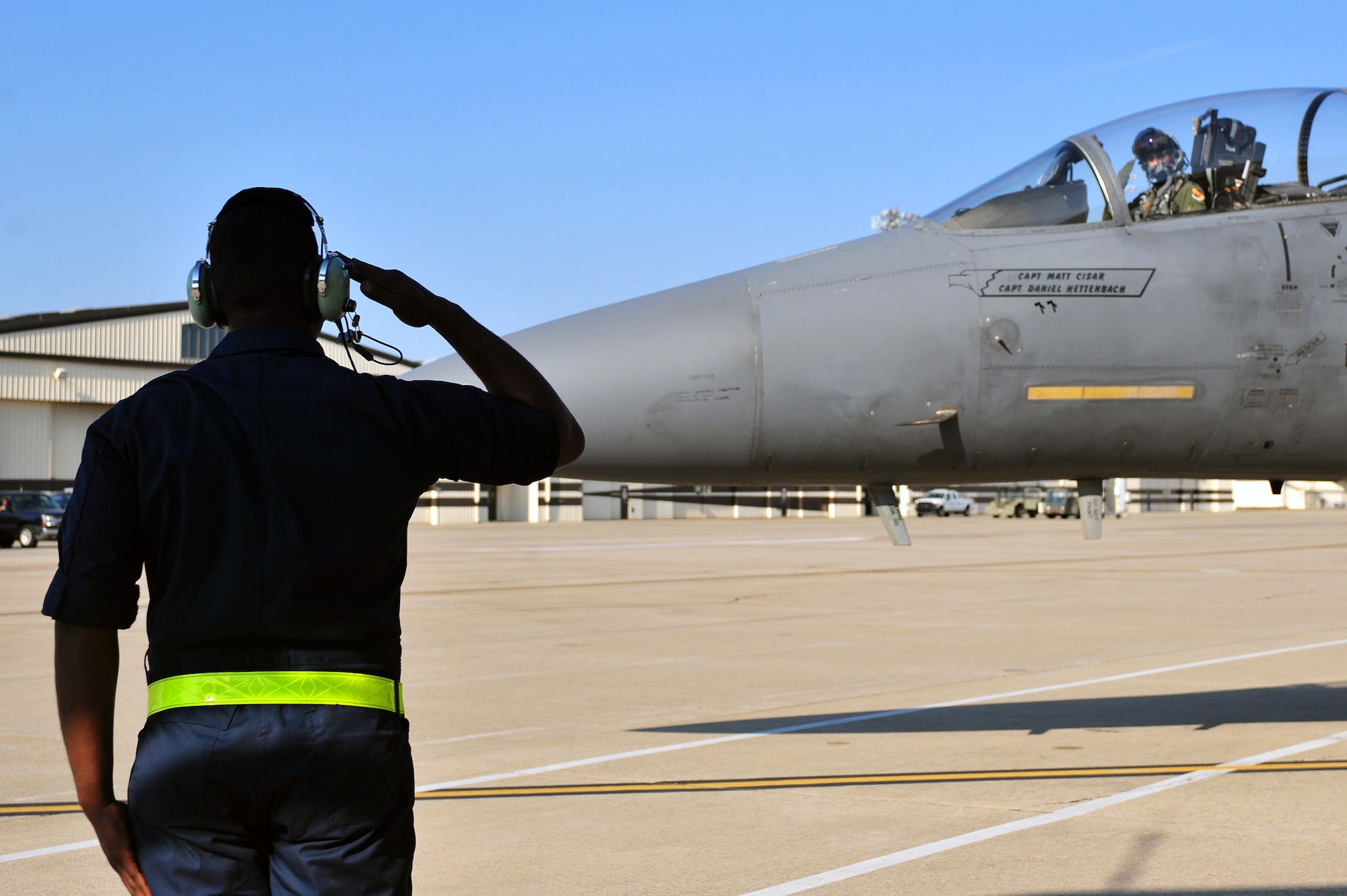 Airman 1st Class Scott Boyer, 4th Aircraft Maintenance Squadron crew chief, salutes an F-15E Strike Eagle at Seymour Johnson Air Force Base, North Carolina, Oct. 11, 2014, before it heads to Nellis Air Force Base, Nevada, in support of the U.S. Air Force Weapons School’s Weapons Instructor Course. Airmen and aircraft assigned to the 4th Fighter Wing out of Seymour Johnson AFB recently returned home from Nellis AFB, where they were tasked with enhancing the F-15E Strike Eagle capability and providing additional air support for the students attending the Weapons School’s Weapons Instructor Course. (U.S. Air Force photo/Senior Airman John Nieves Camacho)
