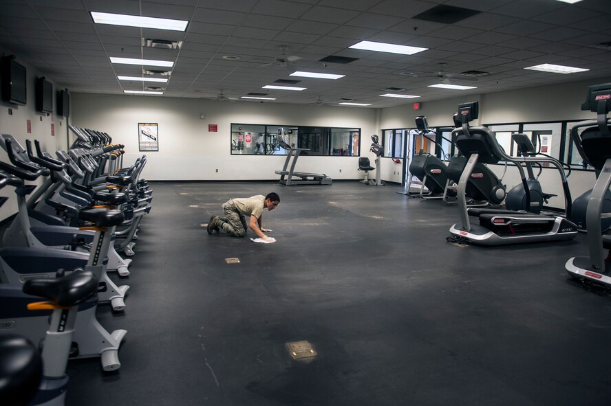 U.S. Air Force Airman Jonathan-Martin Webb, 23d Force Support Squadron services apprentice, cleans the cardio room floor Nov. 4, 2014, at Moody Air Force Base, Ga. Webb was cleaning the floor in preparation for a delivery of new cardio equipment. (U.S. Air Force photo by Senior Airman Jarrod Grammel/Released)
