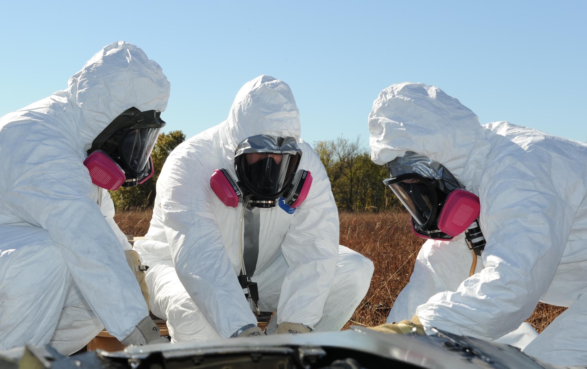 Oklahoma Air National Guard members from the 138th Fighter Wing wrap a vertical stabilizer, Oct. 29, 2014, near Moline Kan. The Crash, Damaged, Disabled, Aircraft Recovery team prepared the part for safe transport to a new location. (U.S. Air Force photo/Airman 1st Class David Bernal Del Agua)