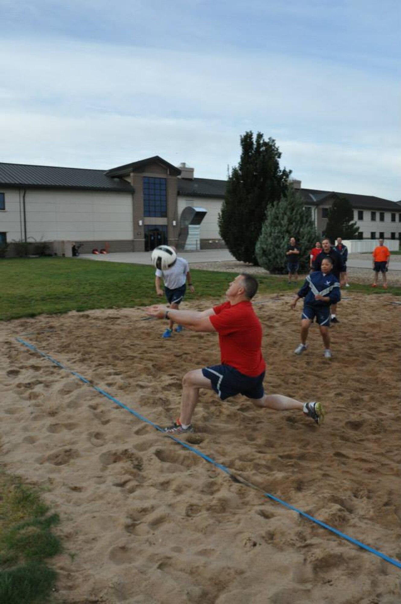 Chief Master Sgt. Sean Strong, Air Reserve Personnel Center, returns a serve during a match that featured the Buckley Chiefs and Shirts team versus the Airman Leadership School Class Oct. 8, 2014, on Buckley Air Force Base, Colo. Three chief master sergeants and the first sergeant from ARPC contributed to the Buckley Chiefs and Shirts team that put up a valiant effort during two matches. Strong, along with Chief Master Sgts. Ruthe Flores and James Kirkley were a force to be reckoned as they pushed the Airmen to their limits. The matches were hard fought and closely officiated by ARPC's shirt, Senior Master Sgt. John Neeley. (U.S. Air Force photo/Tech. Sgt. Rob Hazelett)