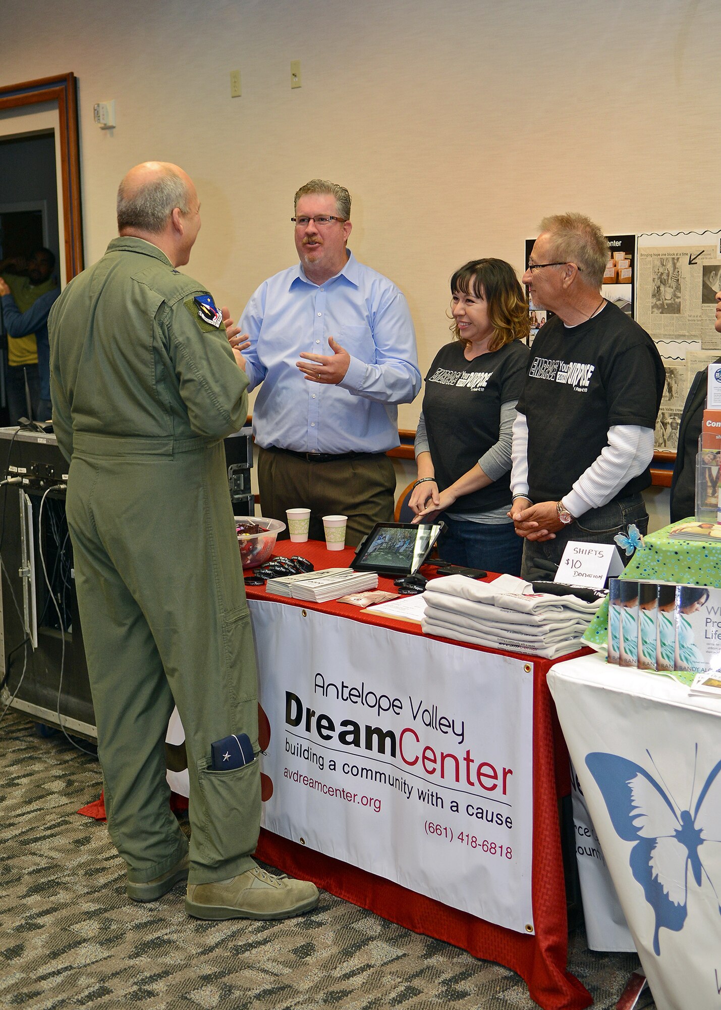 Brig. Gen. Michael Brewer speaks with representatives from the Antelope Valley Dream Center during the Wingman Day event and fair which was held at the Airman and Family Readiness Center Nov. 3. The AV Dream Center was just one of many nonprofit organizations who attended the event to include on-base helping agencies. The AV Dream Center is a volunteer driven, faith-based 501(c)3 nonprofit organization that is committed to reaching people in order to build them up, restore hope in their lives, and inspire them to dream again. Their goal is to promote a community of people who build and support one another by sharing their time, resources, and love to those in need. (U.S. Air Force photo by Jet Fabara)