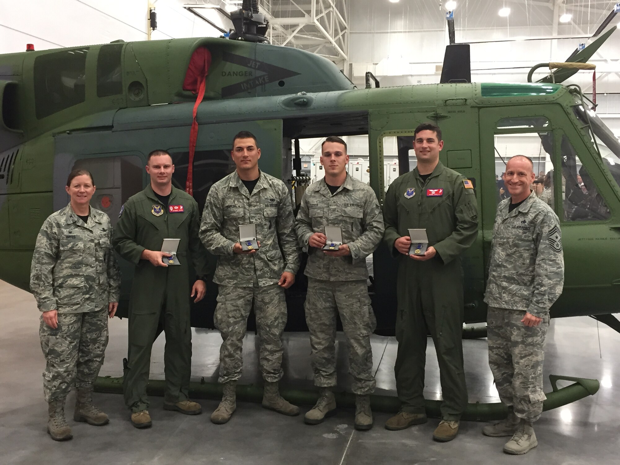Col. Tracey Hayes (far left), 90th Missile Wing commander, and Chief Master Sgt. Samuel Couch (far right), 90th MW command chief, pose with Airmen in the 90th MW's 2014 Global Strike Challenge team Nov. 5, 2014, at Barksdale Air Force Base, La. Secretary of the Air Force Deborah Lee James presented the Nuclear Deterrence Operations Service Medal for the first time ever to 25 Airmen during Air Force Global Strike Command's 2014 Global Strike Challenge that day. (Courtesy photo)