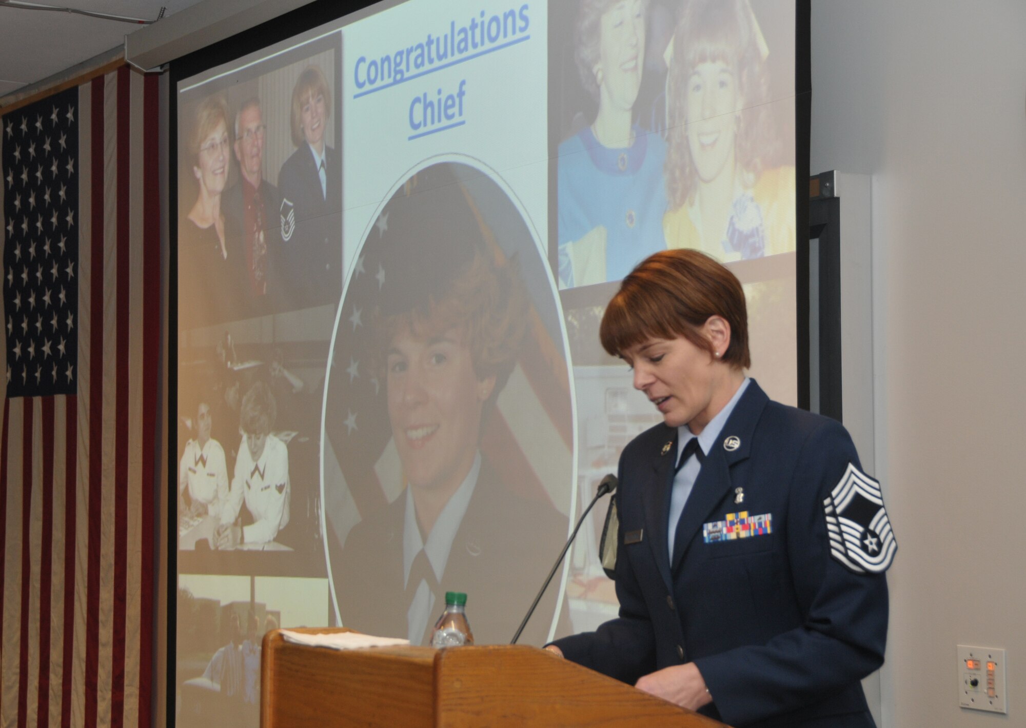 Newly promoted Chief Master Sgt. Jacqueline Sweet-McNeill, 109th Medical Group superintendent, speaks during her promotion ceremony at Stratton Air National Guard Base, New York, on Nov. 2, 2014. (U.S. Air National Guard photo by Tech. Sgt. Catharine Schmidt/Released)