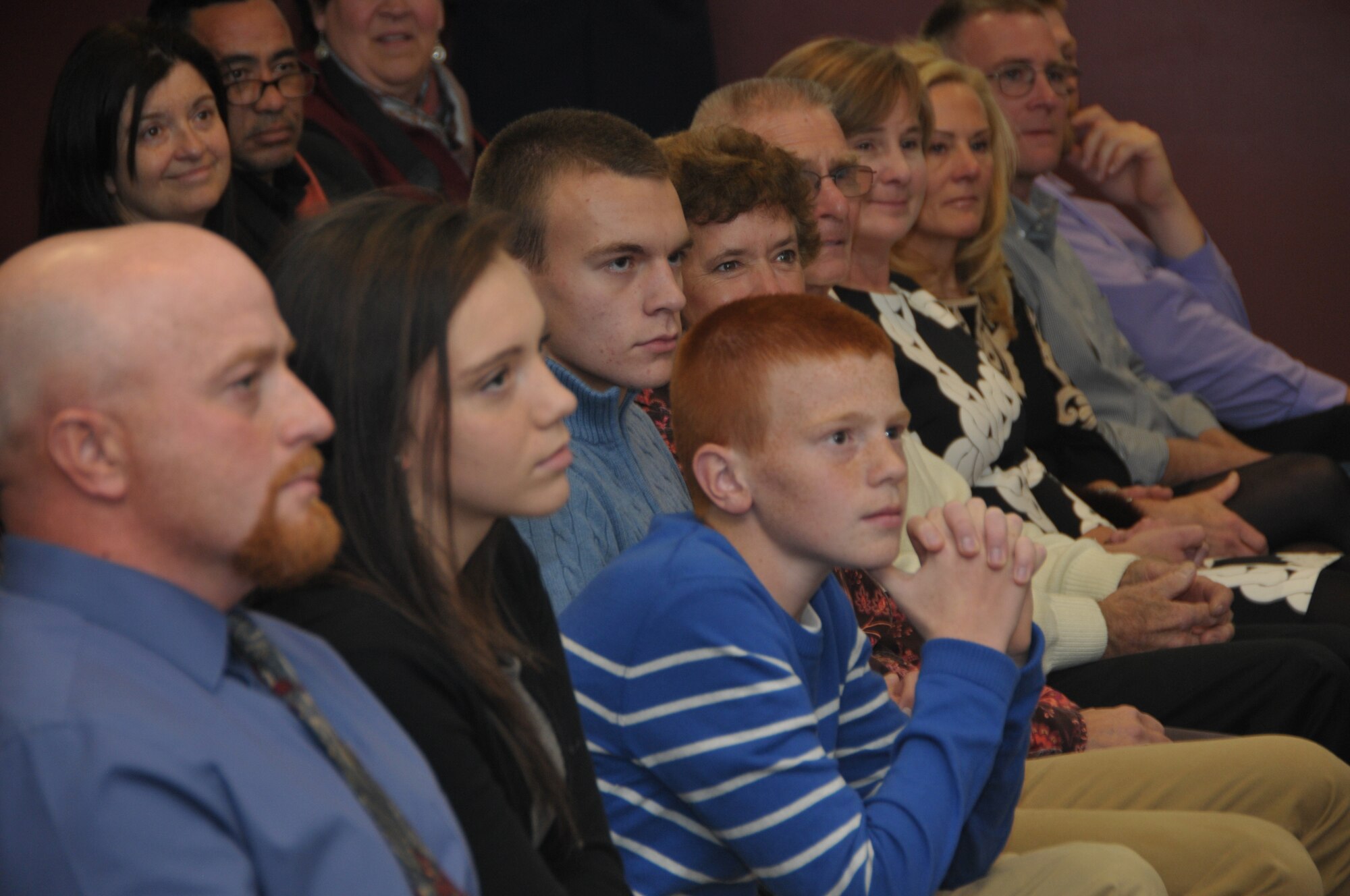 The family of newly promoted Chief Master Sgt. Jacqueline Sweet-McNeill listen as she speaks during her promotion ceremony at Stratton Air National Guard Base, New York, on Nov. 2, 2014. Sweet-McNeill is the 109th Medical Group superintendent. (U.S. Air National Guard photo by Tech. Sgt. Catharine Schmidt/Released)