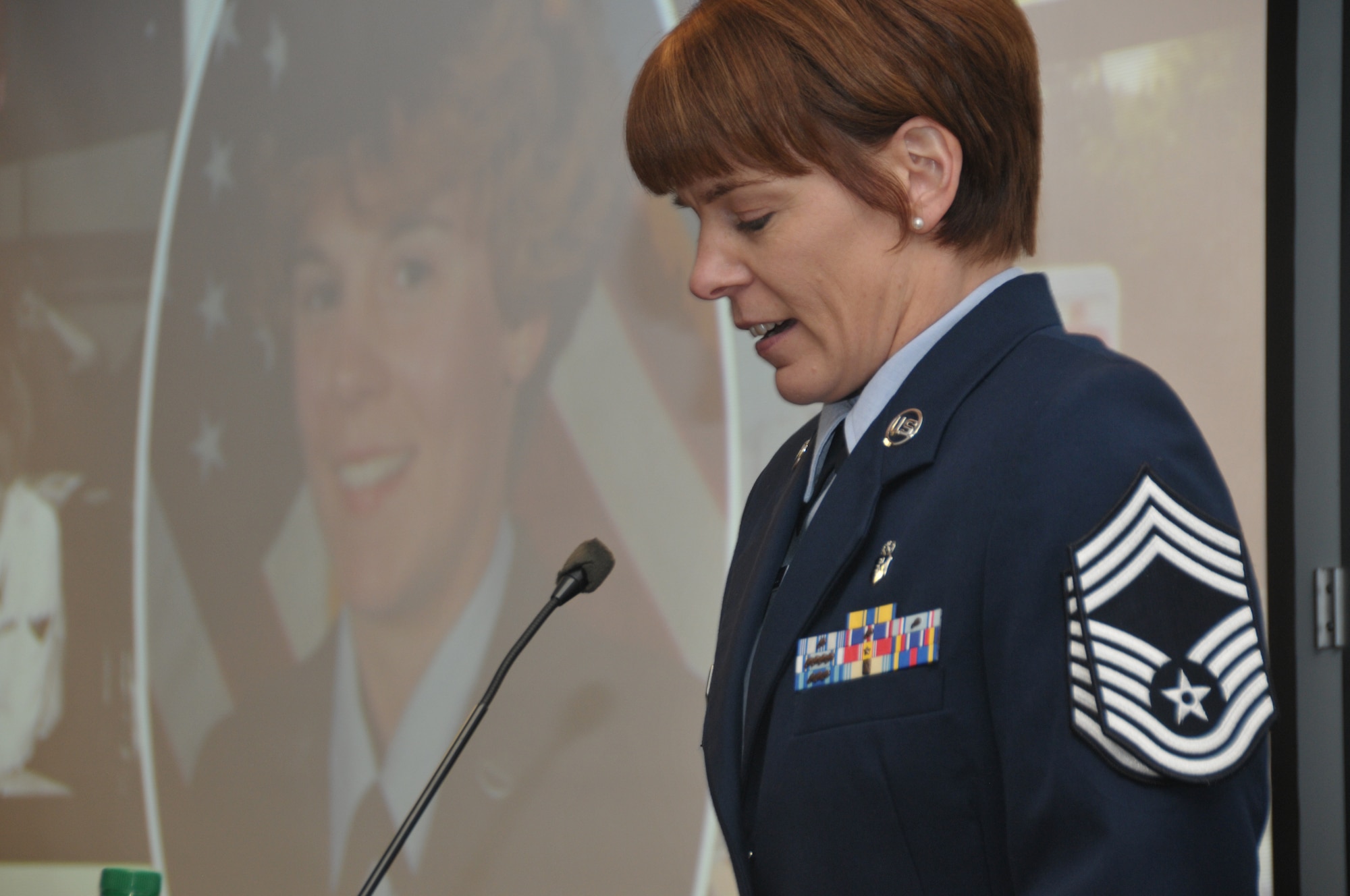 Newly promoted Chief Master Sgt. Jacqueline Sweet-McNeill, 109th Medical Group superintendent, speaks during her promotion ceremony at Stratton Air National Guard Base, New York, on Nov. 2, 2014. (U.S. Air National Guard photo by Tech. Sgt. Catharine Schmidt/Released)