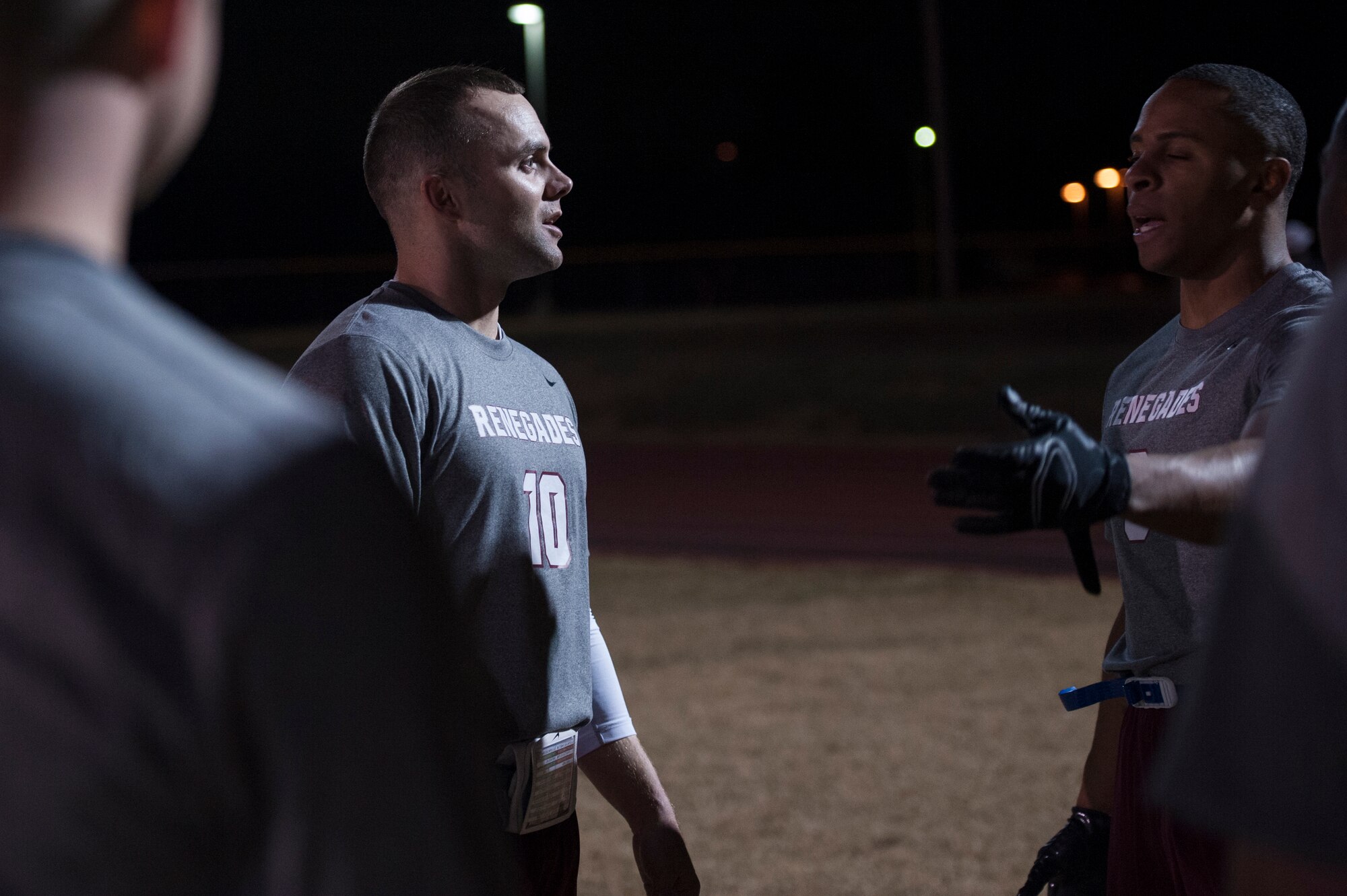 Army Sgt. Justin Heflin, Camp Robinson’s head coach and quarterback, discusses defensive strategy with his team Nov. 3, 2014, at Little Rock Air Force Base, Ark.