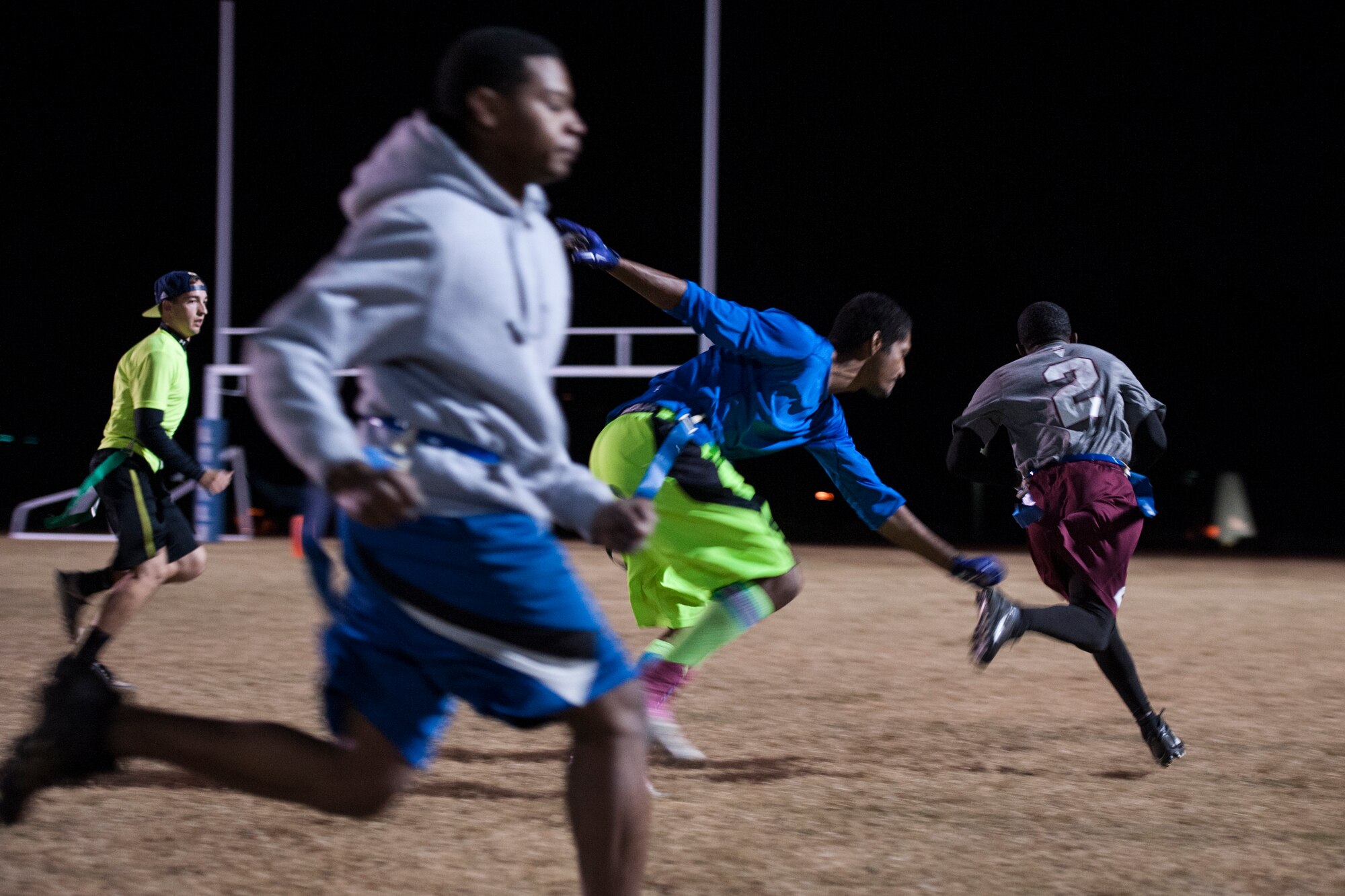 The 19th Contracting Squadron flag football team chases down Army Staff Sgt. Mancel Castleberry, a wide receiver for Camp Robinson Nov. 3, 2014, at Little Rock Air Force Base, Ark.