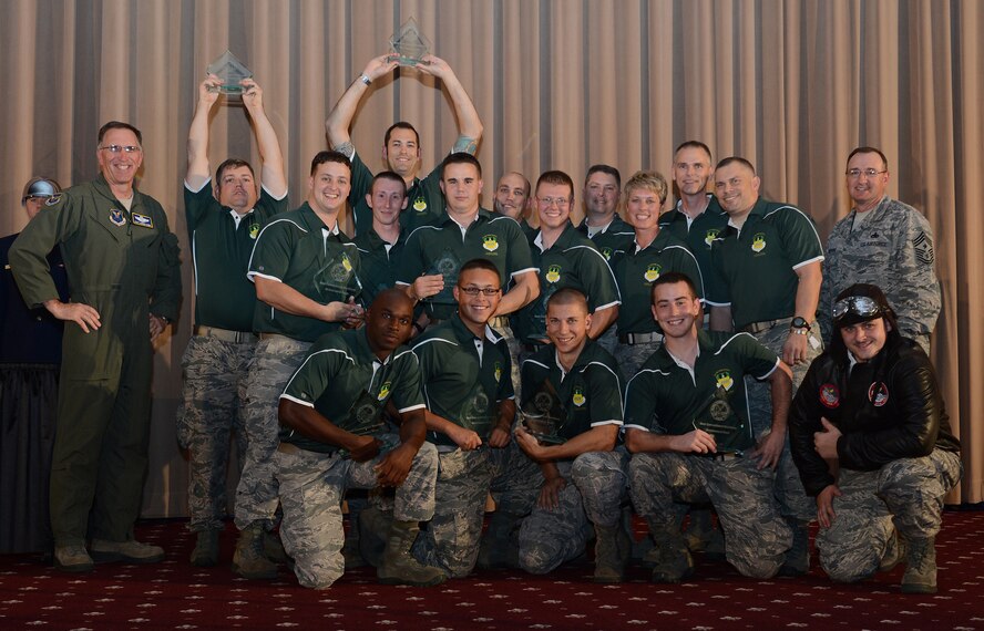 The 2nd Bomb Wing celebrates after winning best bomber conventional munitions maintenance team in the Air Force at the 2014 Global Strike Challenge score posting at Barksdale Air Force Base, La., Nov. 5. The challenge is the nation's premier bomber, ICBM, helicopter operations and security forces competition with units from AFGSC, Air Combat Command, Air Force Reserve Command and the Air National Guard. More than 350 competitors and around 800 personnel attended the three-day capstone events. (U.S. Air Force photo/Senior Airman Benjamin Gonsier)