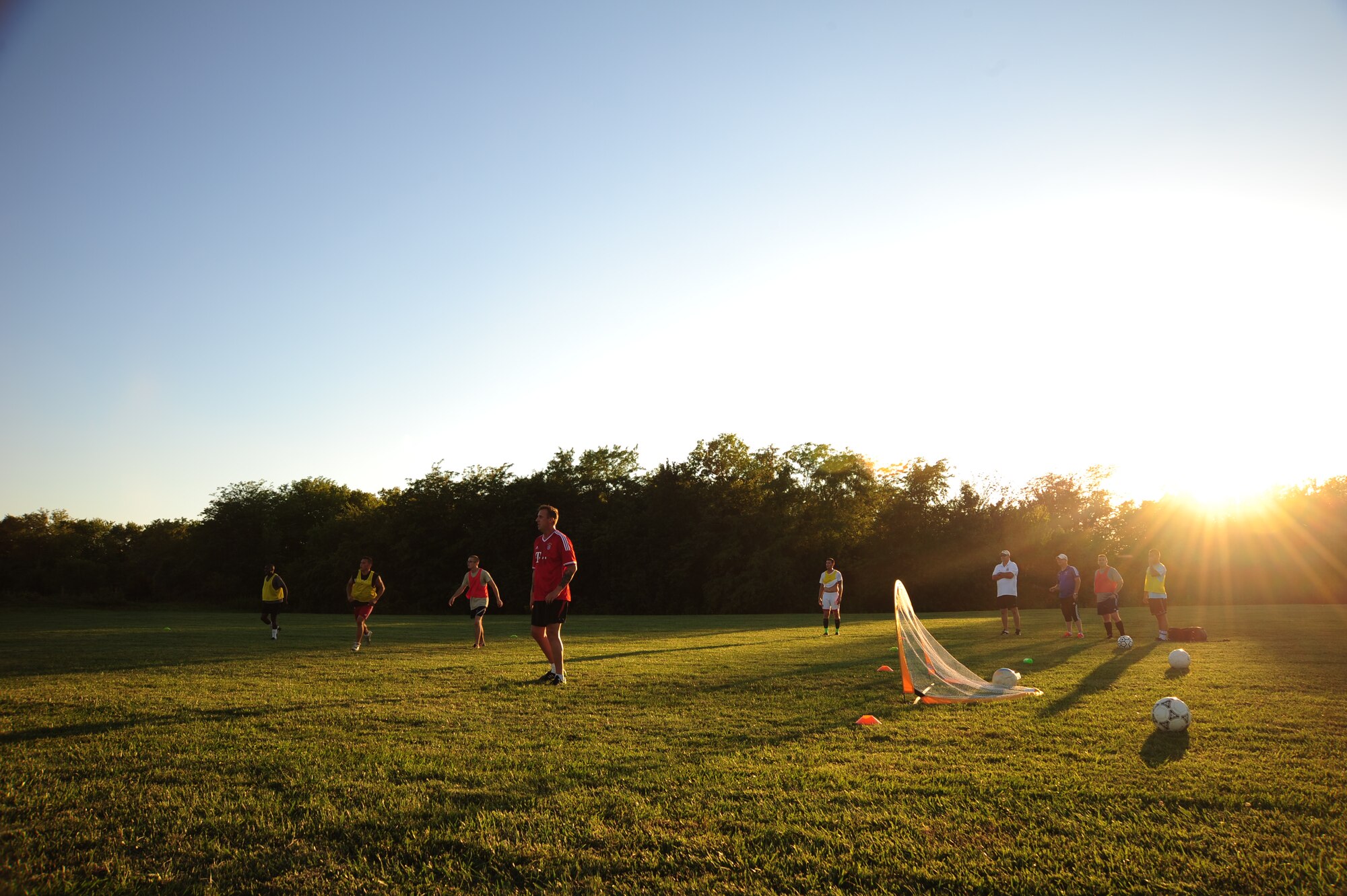 Members of the Sporting Whiteman soccer team take a 10-minute break during a practice session at Cloverdale Complex in Sedalia, Mo., Aug. 12, 2014. The team was preparing for the Defender’s Cup, an Armed Forces soccer tournament, which they scored sixth place in against 36 other teams. (U.S. Air Force photo by Staff Sgt. Nick Wilson/Released)
