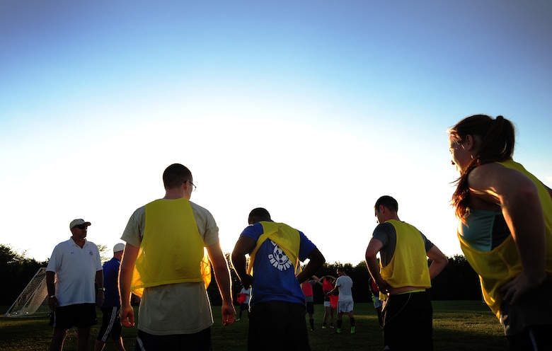 Members of the Sporting Whiteman soccer team take a 10-minute break during a practice session at Cloverdale Complex in Sedalia, Mo., Aug. 12, 2014. The team was preparing for the Defender’s Cup, an Armed Forces soccer tournament, which they scored sixth place in against 36 other teams. (U.S. Air Force photo by Staff Sgt. Nick Wilson/Released)