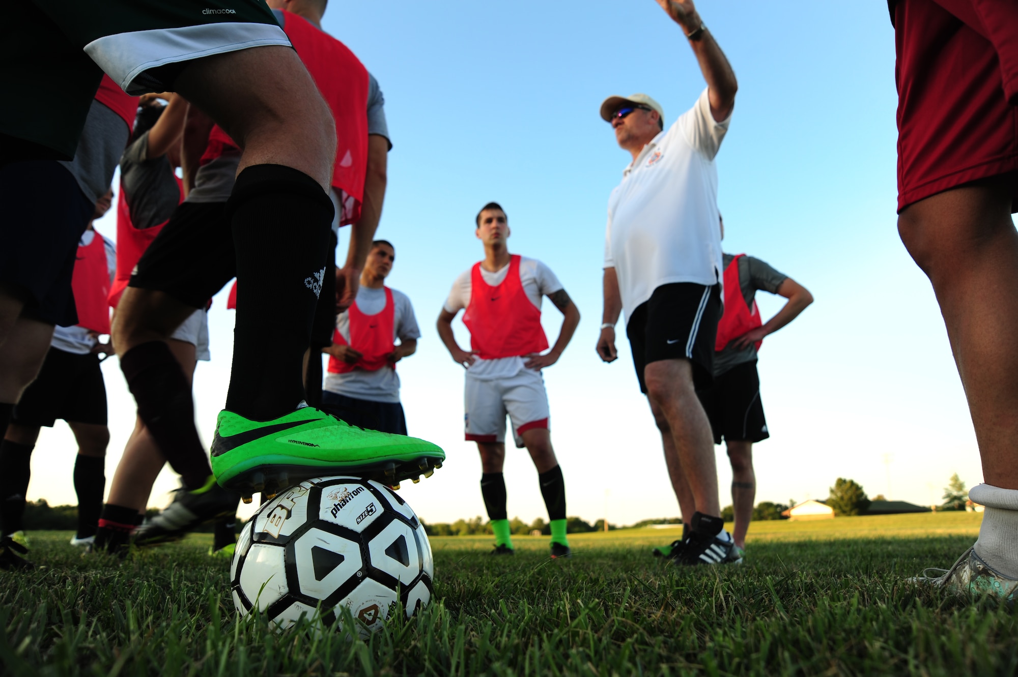 Roy Dietzman, Sporting Whiteman varsity soccer team head coach, mentors players on the importance of playing aggressively after a scrimmage at Cloverdale Complex in Sedalia, Mo., Aug. 12, 2014. The team practices twice a week and scrimmages against various semi-pro and collegiate soccer teams each month. (U.S. Air Force photo by Staff Sgt. Nick Wilson/Released)