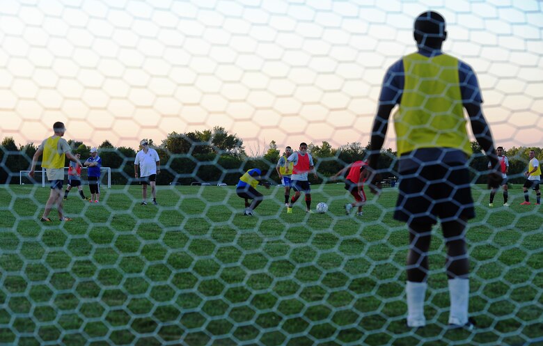 Members of the Sporting Whiteman soccer team play in a scrimmage during a practice session at Cloverdale Complex in Sedalia, Mo., Aug. 12, 2014. The team was preparing for the Defender’s Cup, an Armed Forces soccer tournament, which they scored sixth place in against 36 other teams. (U.S. Air Force photo by Staff Sgt. Nick Wilson/Released)