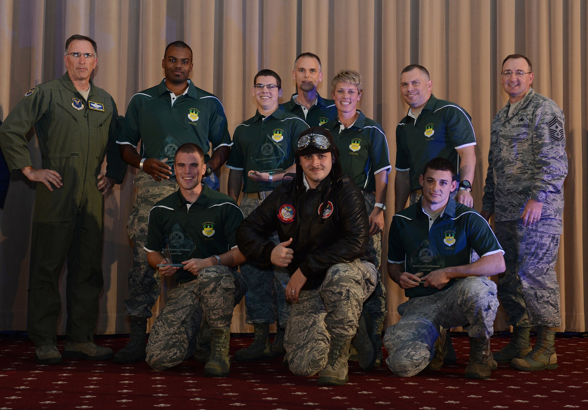 The 2nd Bomb Wing celebrates after winning the best bomber conventional load team in the Air Force at the 2014 Global Strike Challenge score posting at Barksdale Air Force Base, La., Nov. 5. The challenge is the nation's premier bomber, ICBM, helicopter operations and security forces competition with units from AFGSC, Air Combat Command, Air Force Reserve Command and the Air National Guard. More than 350 competitors and around 800 personnel attended the three-day capstone events. (U.S. Air Force photo/Senior Airman Benjamin Gonsier)
