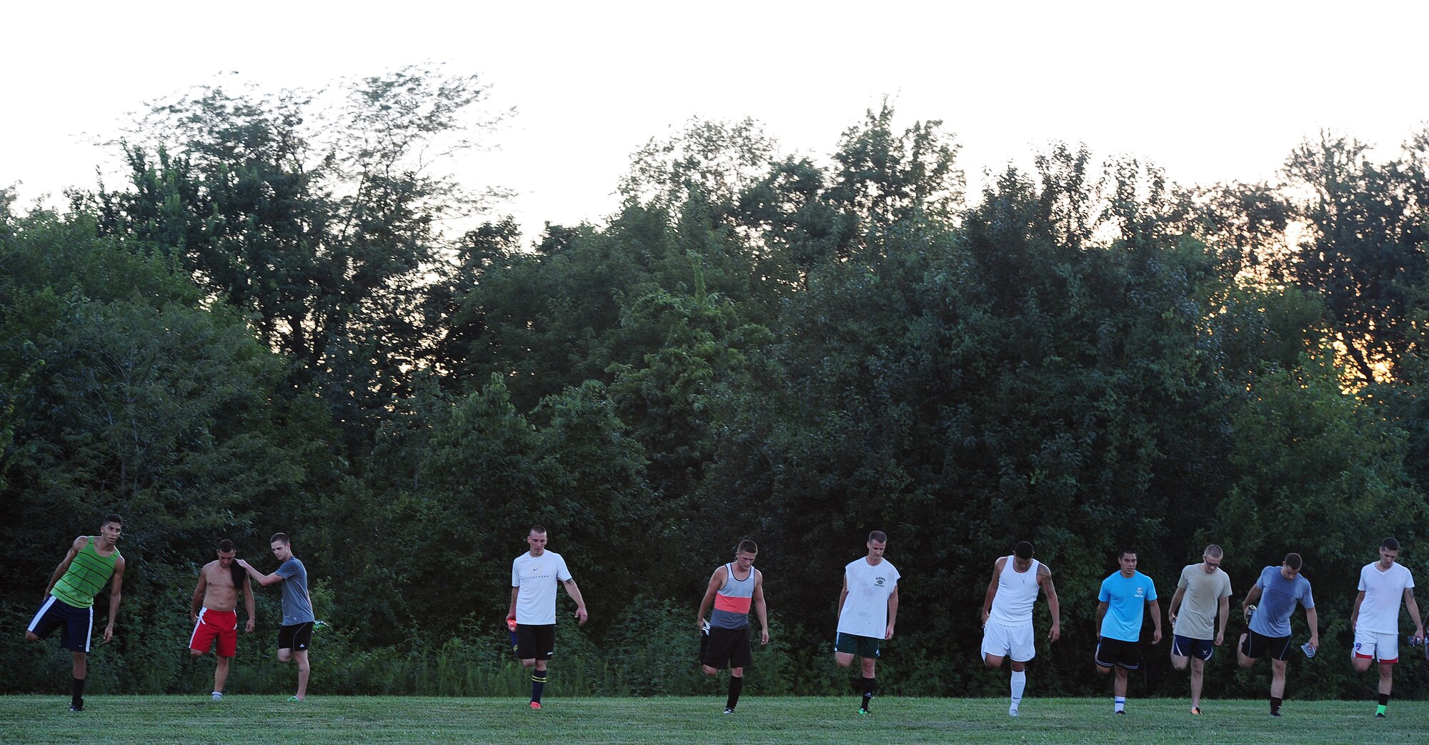 Members of the Sporting Whiteman soccer team take a stretch after a practice session at Cloverdale Complex in Sedalia, Mo., Aug. 12, 2014. The team was preparing for the Defender’s Cup, an Armed Forces soccer tournament, which they scored sixth place in against 36 other teams. (U.S. Air Force photo by Staff Sgt. Nick Wilson/Released)