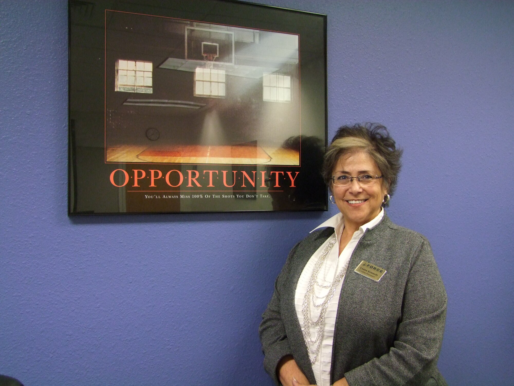 Luana Kennedy, an Academy human resources technician, saved the Air Force $30,000 by submitting a suggestion to the Airmen Powered by Innovation program to adjust the pay grade and qualification for food service workers who provide extra support during cadet in-processing and Basic Cadet Training. (U.S. Air Force photo/Amber Baillie)