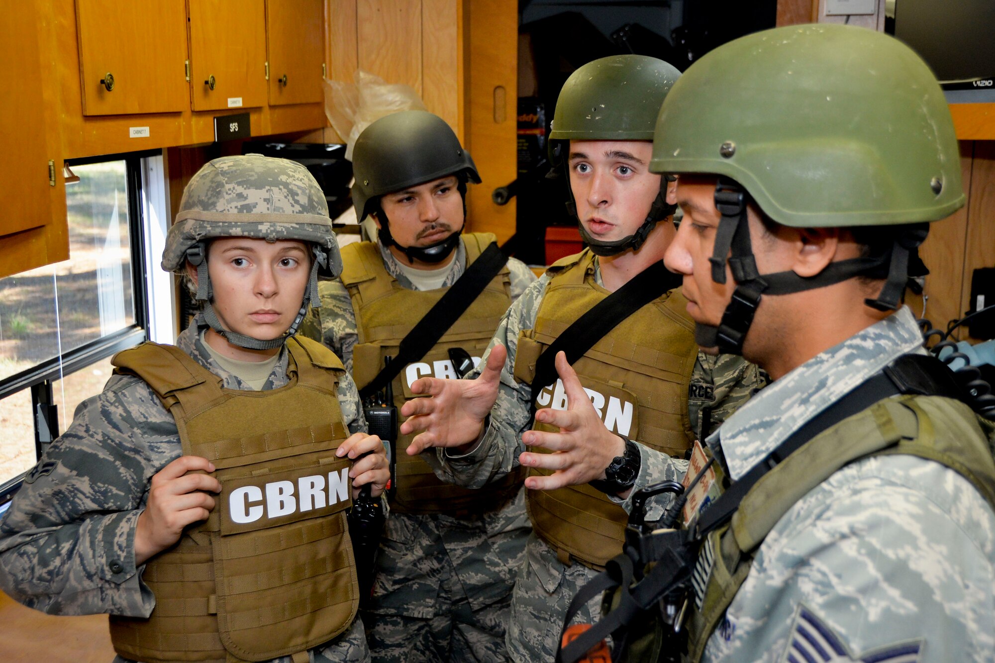 Airmen with the 2nd Civil Engineer Squadron Response Task Force participate in a pre-briefing prior to beginning an exercise on Barksdale Air Force Base, La., Oct. 29, 2014. Pre-briefings are held to assign tasks and inspect equipment prior to entering a scene. (U.S. Air Force photo/Airman 1st Class Mozer O. Da Cunha)