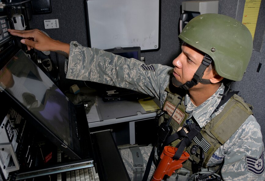 Tech. Sgt. Shawn Jamison, 2nd Civil Engineer Squadron installation emergency manager, sets up a command and control center during an exercise on Barksdale Air Force Base, La., Oct. 29, 2014. Command and control centers are set up to provide network and communication capabilities anywhere in the world. (U.S. Air Force photo/Airman 1st Class Mozer O. Da Cunha)